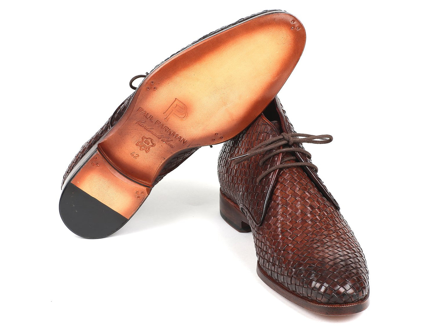 The Paul Parkman Brown Woven Leather Chukka Boots - CK82WVN exude timeless elegance against a pristine white background.