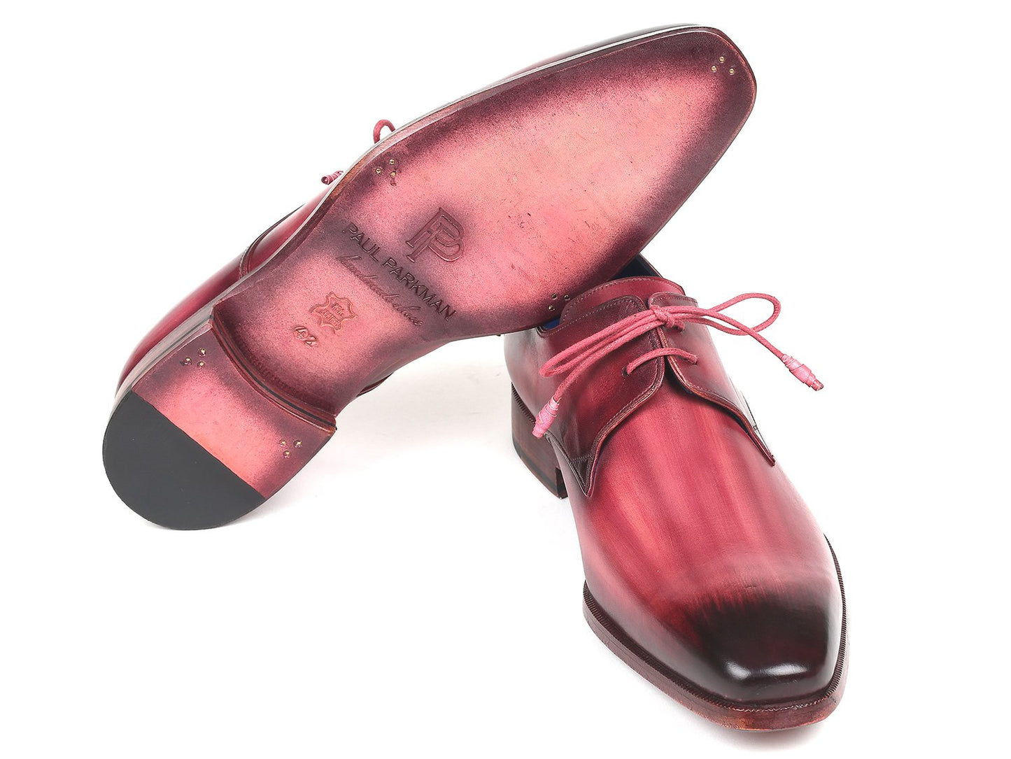 The Paul Parkman Pink & Purple Hand-Painted Derby Shoes (Product Code: 326-PNP) for men are stylishly showcased on a white background. These glossy leather shoes feature an ombre of red shades, highlighted by distinct pink laces and a unique blue interior lining.