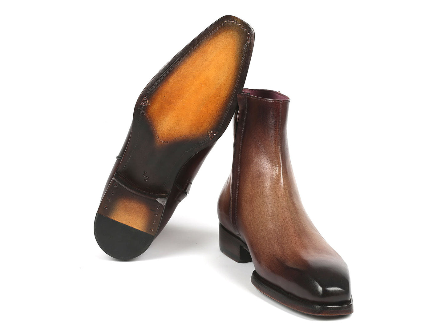 The Paul Parkman Brown Burnished Side Zipper Boots Goodyear Welted (BT3955-BRW) boast an elegant design with their glossy brown gradient finish and convenient side zippers, complemented by a low heel.