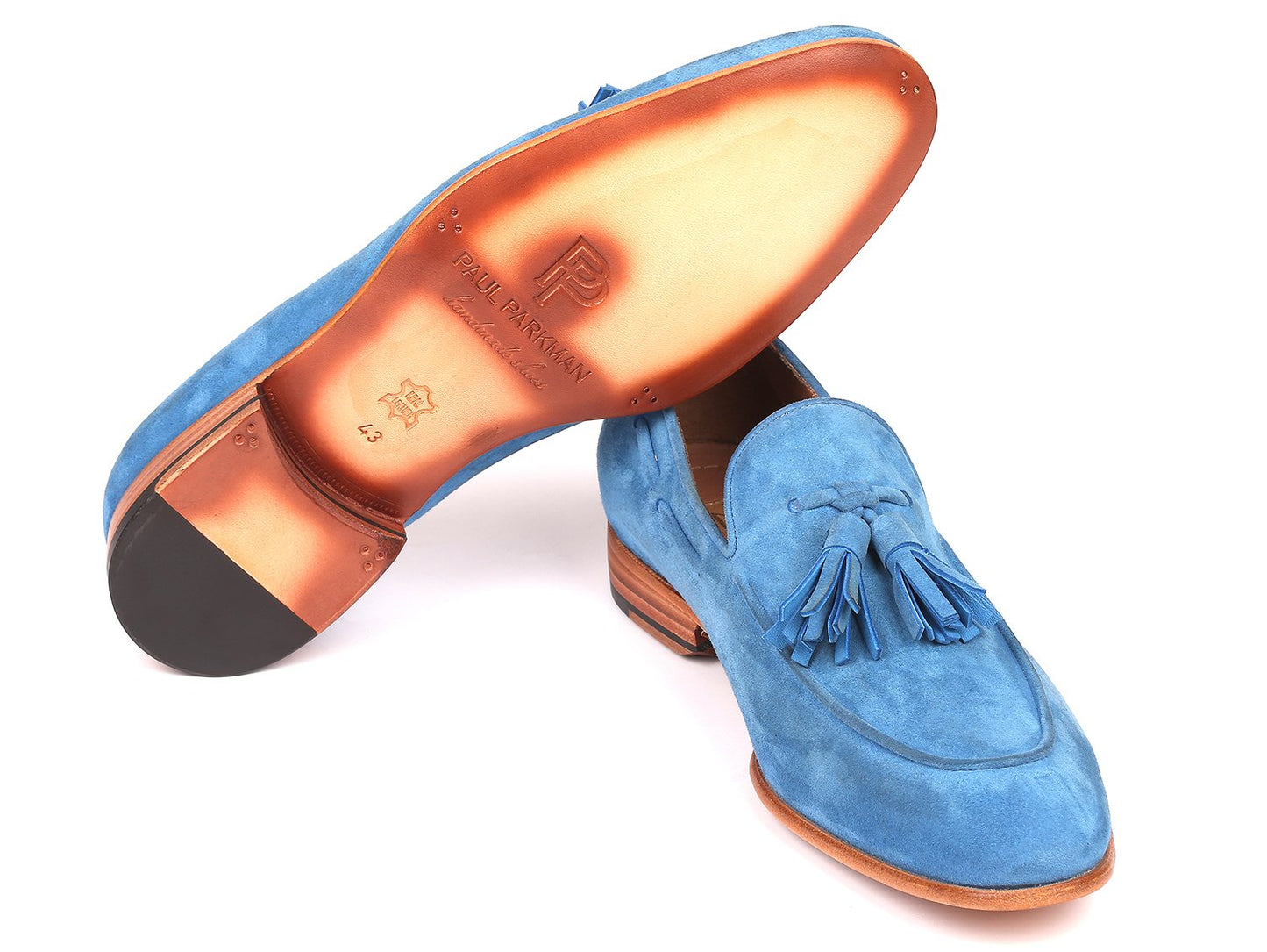 Paul Parkman's made-to-order tassel loafers (model BLU32FG) in blue suede feature distinct tan soles.