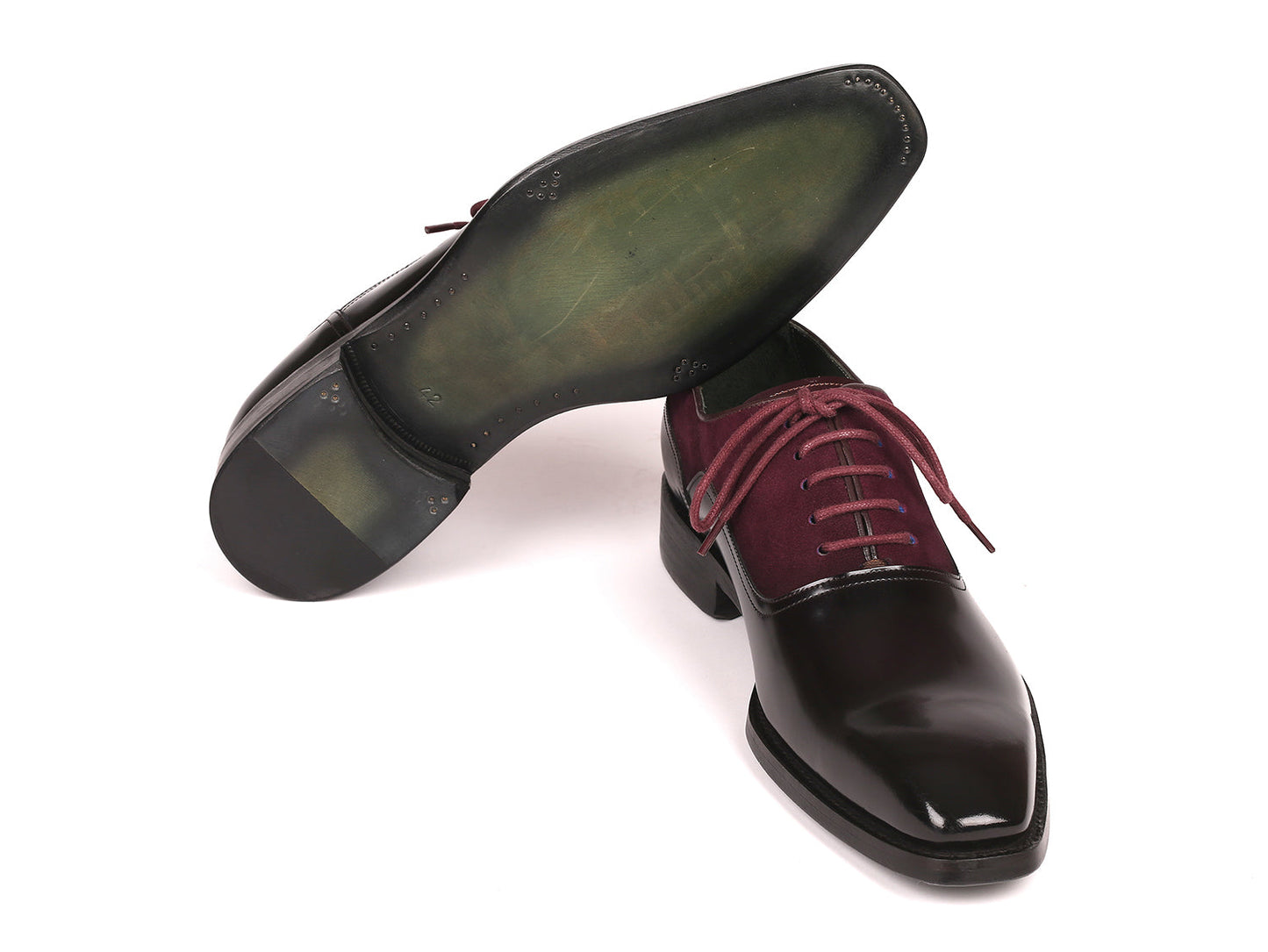 These Paul Parkman Men's Burgundy Suede & Black Patent Oxfords, style 17BUR85, boast a refined design with a stacked heel and Goodyear welted construction, offering a blend of classic sophistication and outstanding durability.