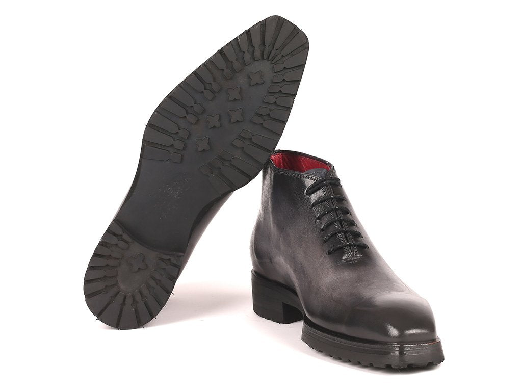 The Paul Parkman Ankle Boots, model 791GRY14, feature a gray burnished finish with a striking red interior lining. Displayed at an angle, these hand-painted leather boots for men offer a unique blend of style and craftsmanship.