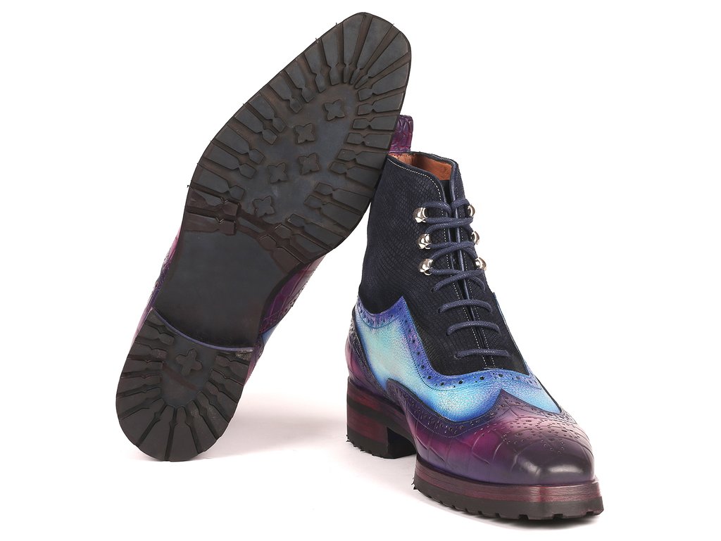 Paul Parkman presents the Three Tone Wingtip Boots in gradient blue and purple. These men's made-to-order boots feature brogue detailing, a durable rubber sole, and dark laces.