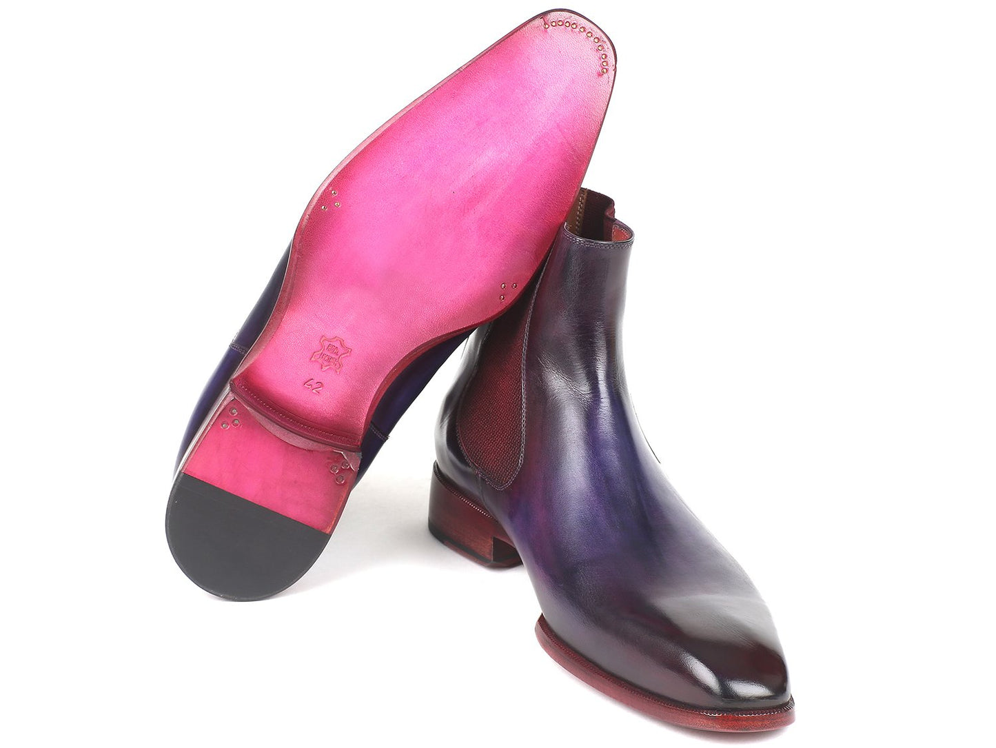 Positioned in an overlapping manner, the Paul Parkman Navy & Purple Chelsea Boots - BT552PUR are hand-painted leather boots featuring maroon elastic panels and a polished finish. Made-to-order, these boots embody a unique style statement, blending artistry with craftsmanship.