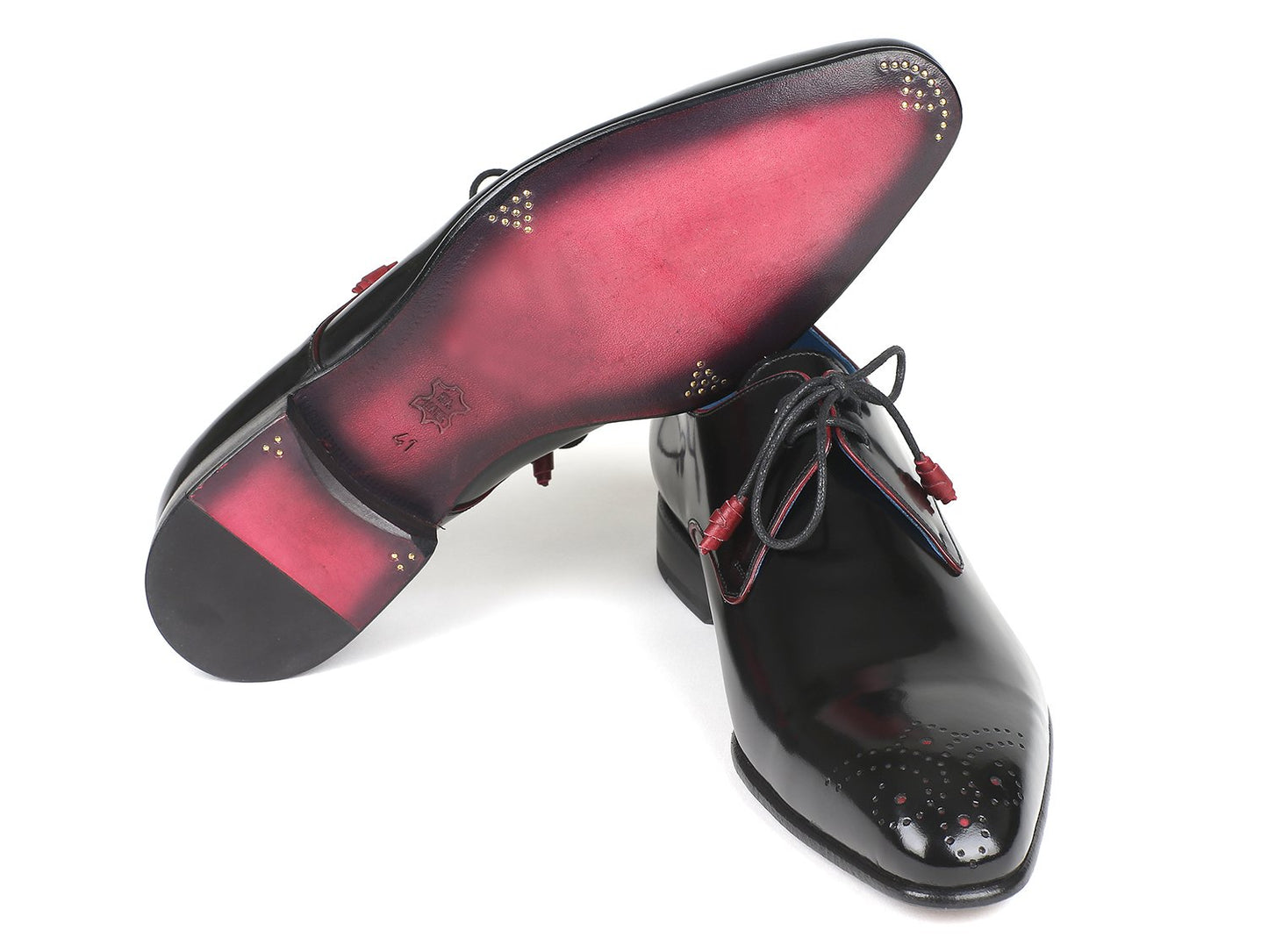 Experience the sleek and sophisticated Paul Parkman Medallion Toe Black Derby Shoes (model 54RG88) featuring a glossy black finish with striking red accents and blue lining. Crafted from polished leather, these shoes come with laces and decorative perforations on the toe for an elegant touch.