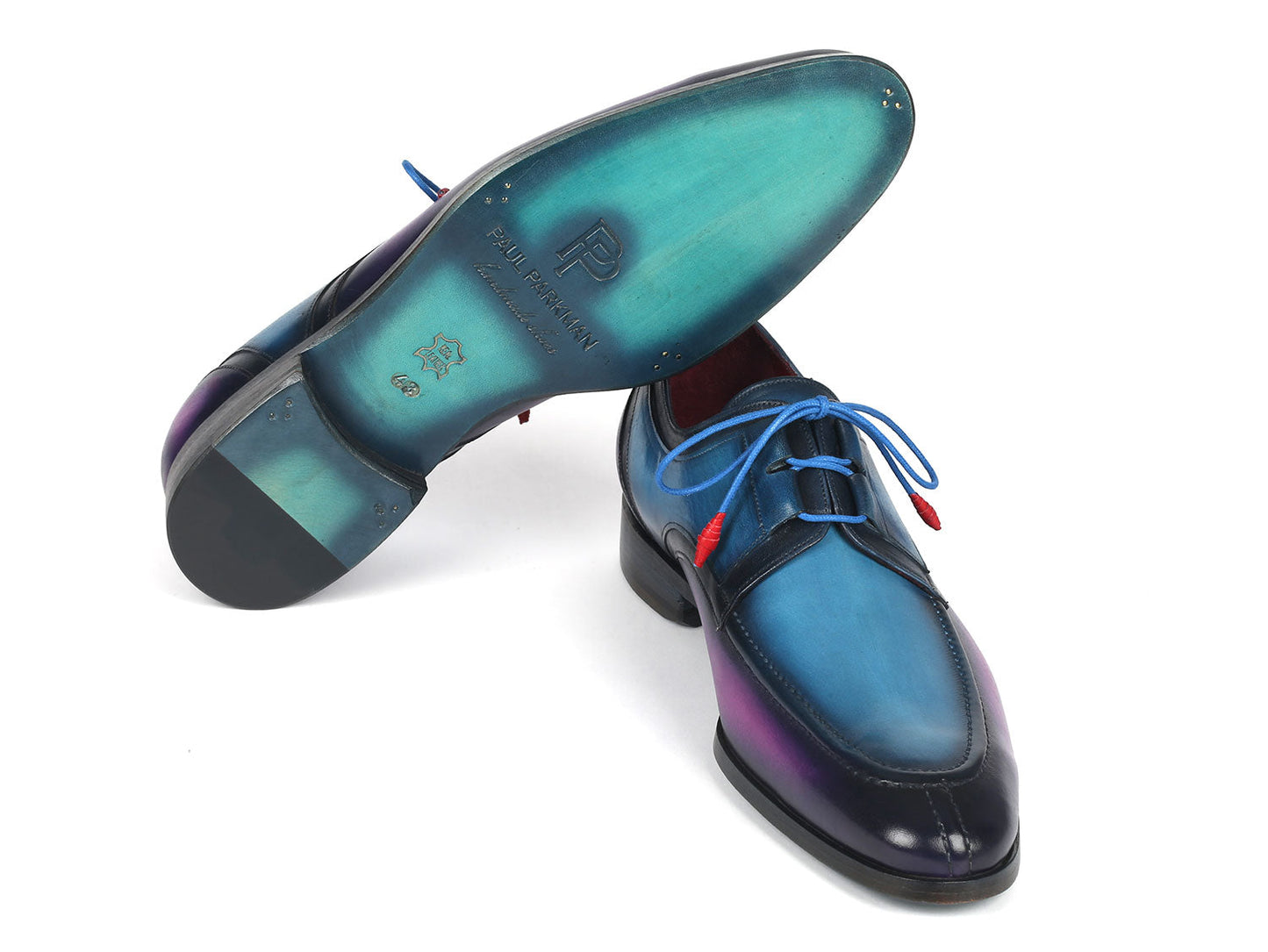 The Paul Parkman Ghillie Lacing Blue & Purple Dress Shoes, model GU568BLP, are hand-painted and elegantly designed with blue laces, showcased against a white background.
