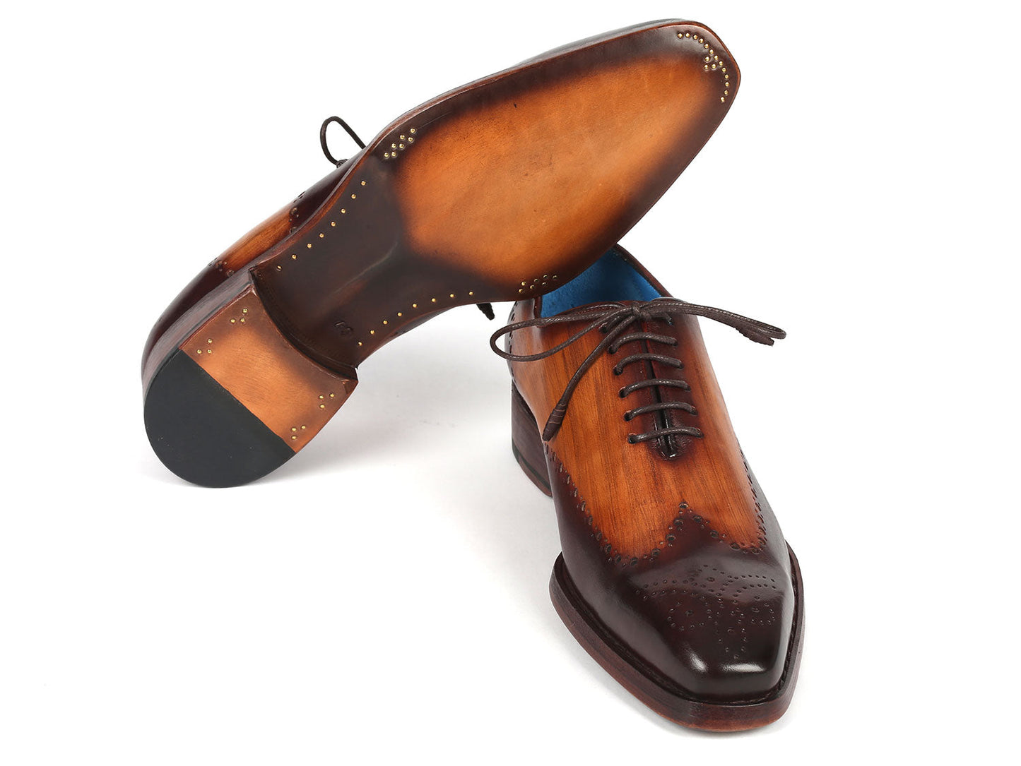 A pair of Paul Parkman Goodyear Welted Two Tone Brown Oxford Shoes - 081-K33, crafted with exquisite brogue detailing and dark laces, displayed on a white background. These handmade shoes by Paul Parkman feature hand-painted leather and Goodyear welted construction, ensuring elegance and durability.