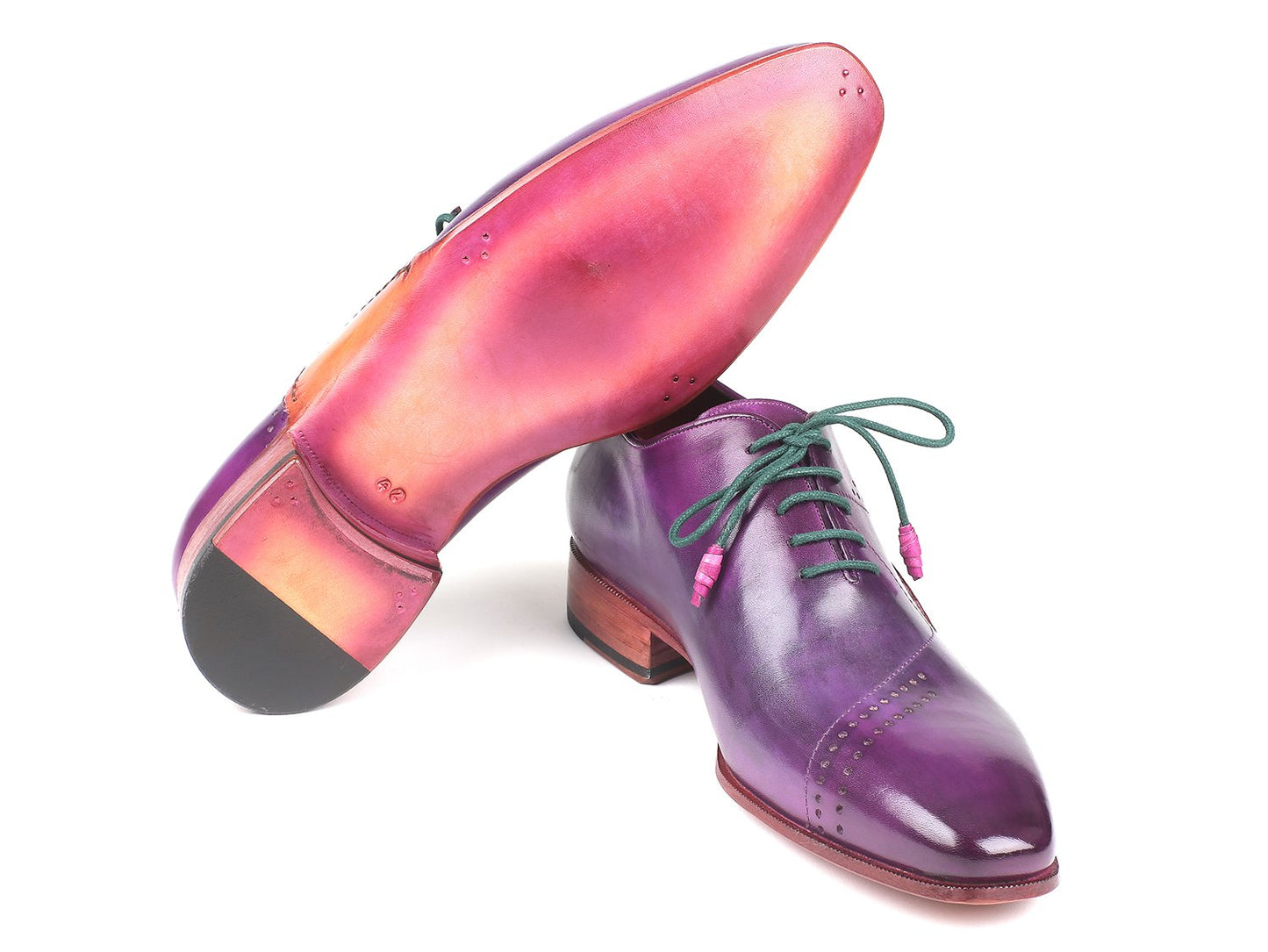 The Paul Parkman Opanka Construction Purple Hand-Painted Oxfords - OPK66KD are crafted with Opanka construction and feature green laces and brown soles. These stylish Oxfords, from the Paul Parkman brand, have perforated detailing on the toe caps and boast a unique design with hand-painted leather that enhances their sophisticated appeal.