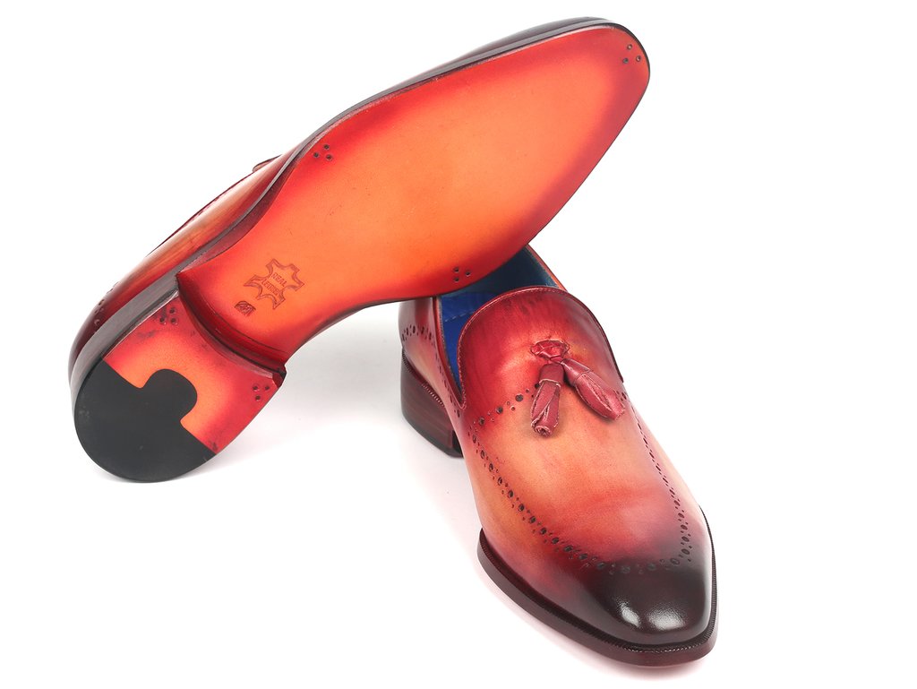 A pair of Paul Parkman Tassel Loafers in burgundy, crafted from hand-painted leather and featuring intricate brogue detailing.