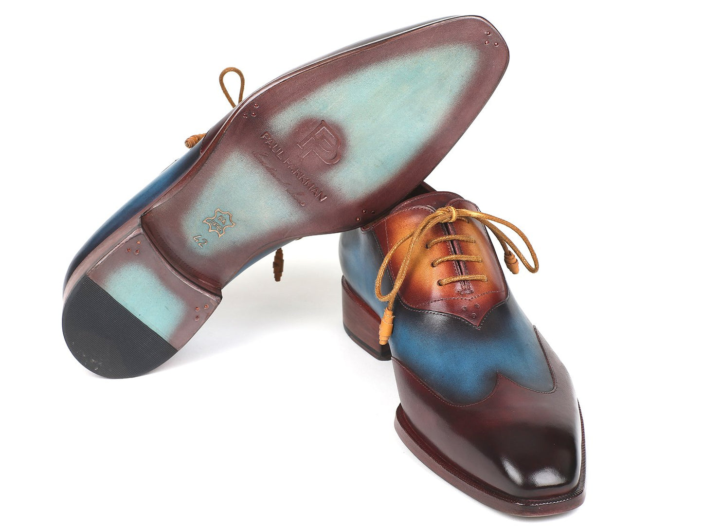 The Paul Parkman Three Tone Wingtip Oxfords in Bordeaux Blue & Camel - AL3249TU are a sophisticated pair of oxfords made from hand-painted leather, showcasing laces and a glossy finish.