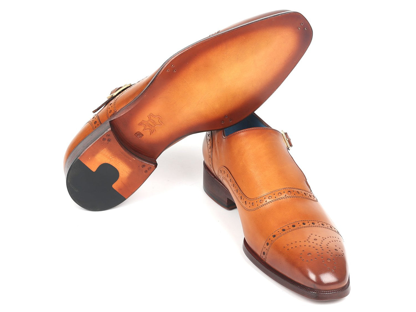 Introducing the Paul Parkman Cap Toe Monkstrap Shoes in Cognac - 65CGN97, an elegant pair crafted from hand-painted leather, featuring decorative perforations and a small heel for a unique touch.