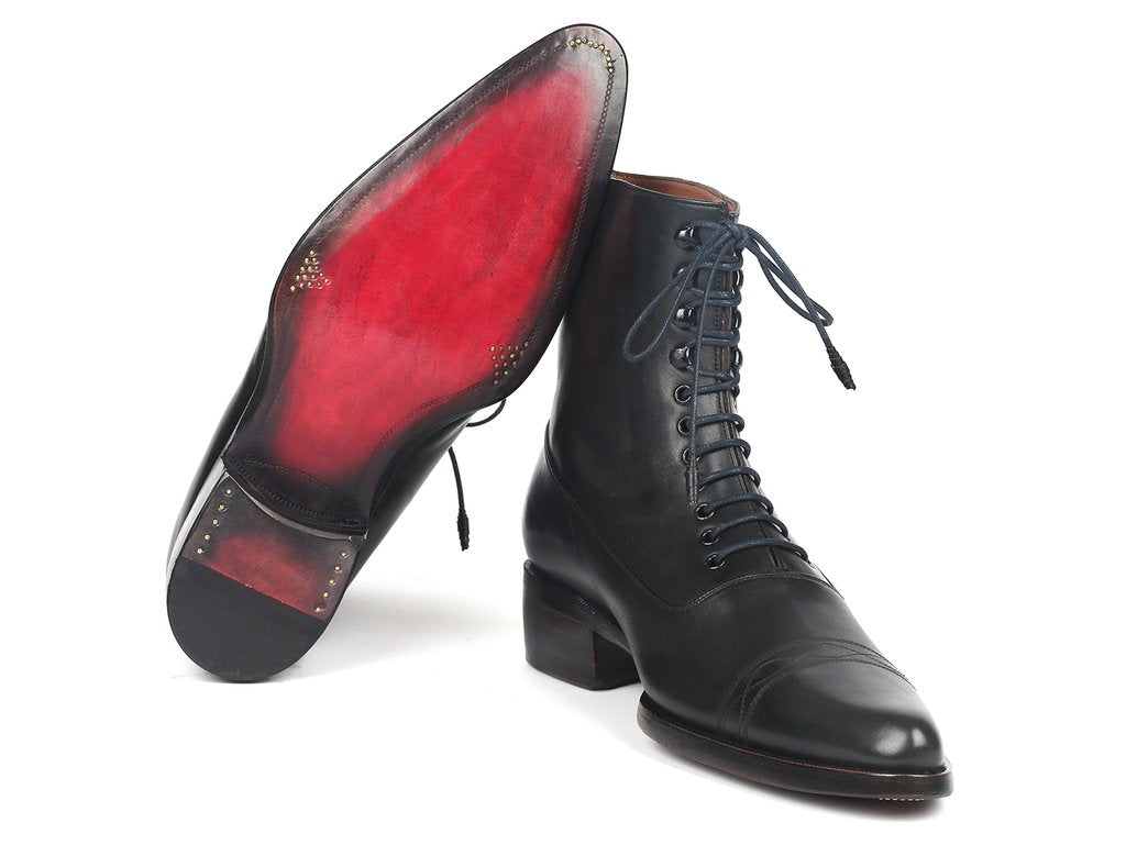 Discover the Paul Parkman Goodyear Welted Boots in black leather, made-to-order and adorned with hand-painted leather and brown soles, featuring expert craftsmanship with Goodyear welted construction.