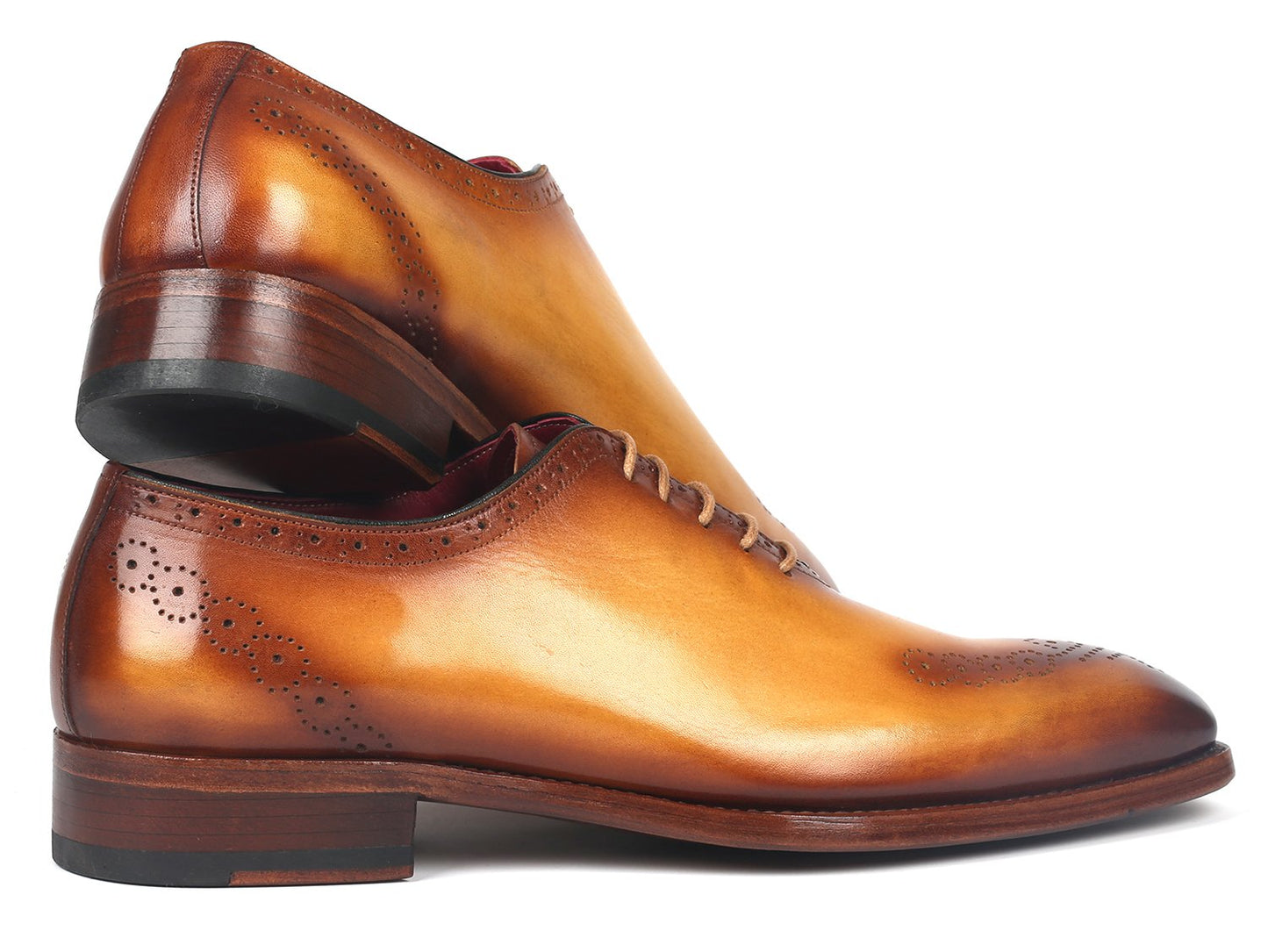 A pair of Paul Parkman Goodyear Welted Punched Oxfords Camel - 7614-CML shoes, featuring elegant decorative perforations and laces, set against a white background. Crafted with Goodyear welted construction for lasting quality and style.