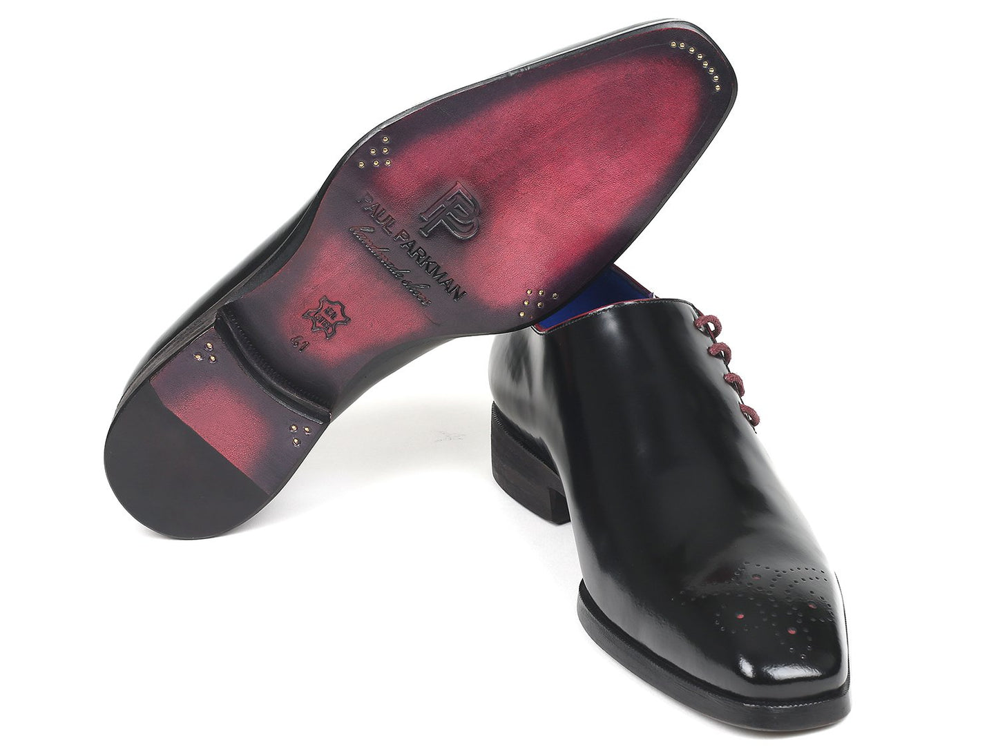 Paul Parkman's Side Lace Oxfords in Black Polished Leather - model 981X65, are shiny dress shoes with a distinct hue and polish. They feature a blue interior and subtle crisscross perforations on the medallion toe.