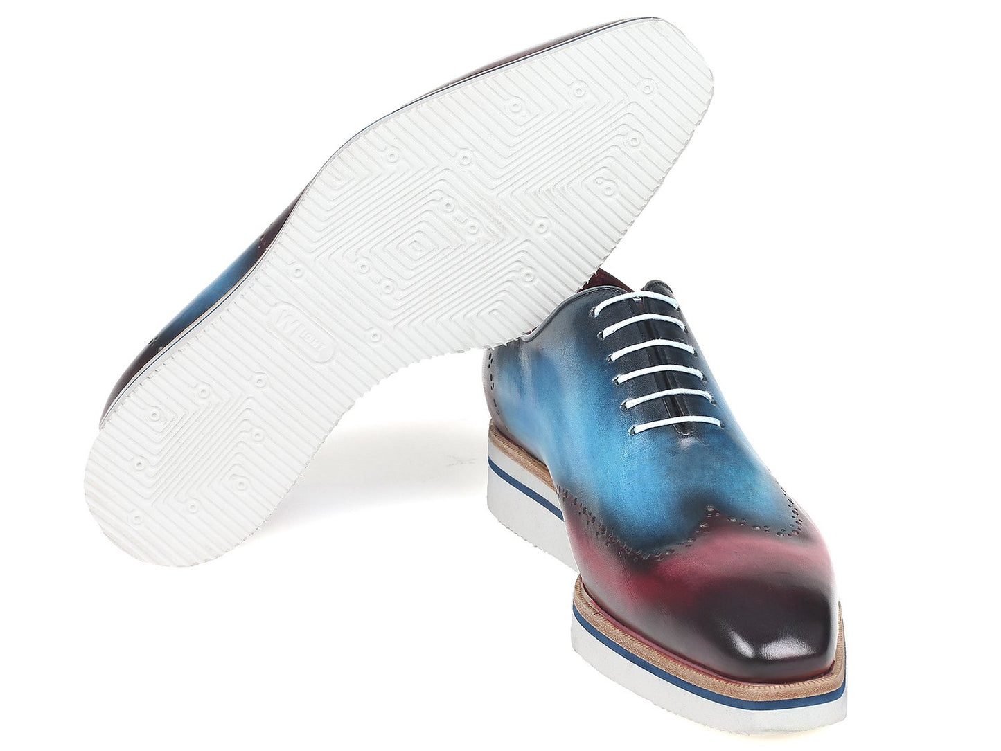 The Paul Parkman Smart Casual Wingtip Oxfords, model 187-BLU-PRP, feature a unique blue and purple gradient leather design with white laces and soles. These hand-painted shoes are ideal for anyone who values bespoke style.