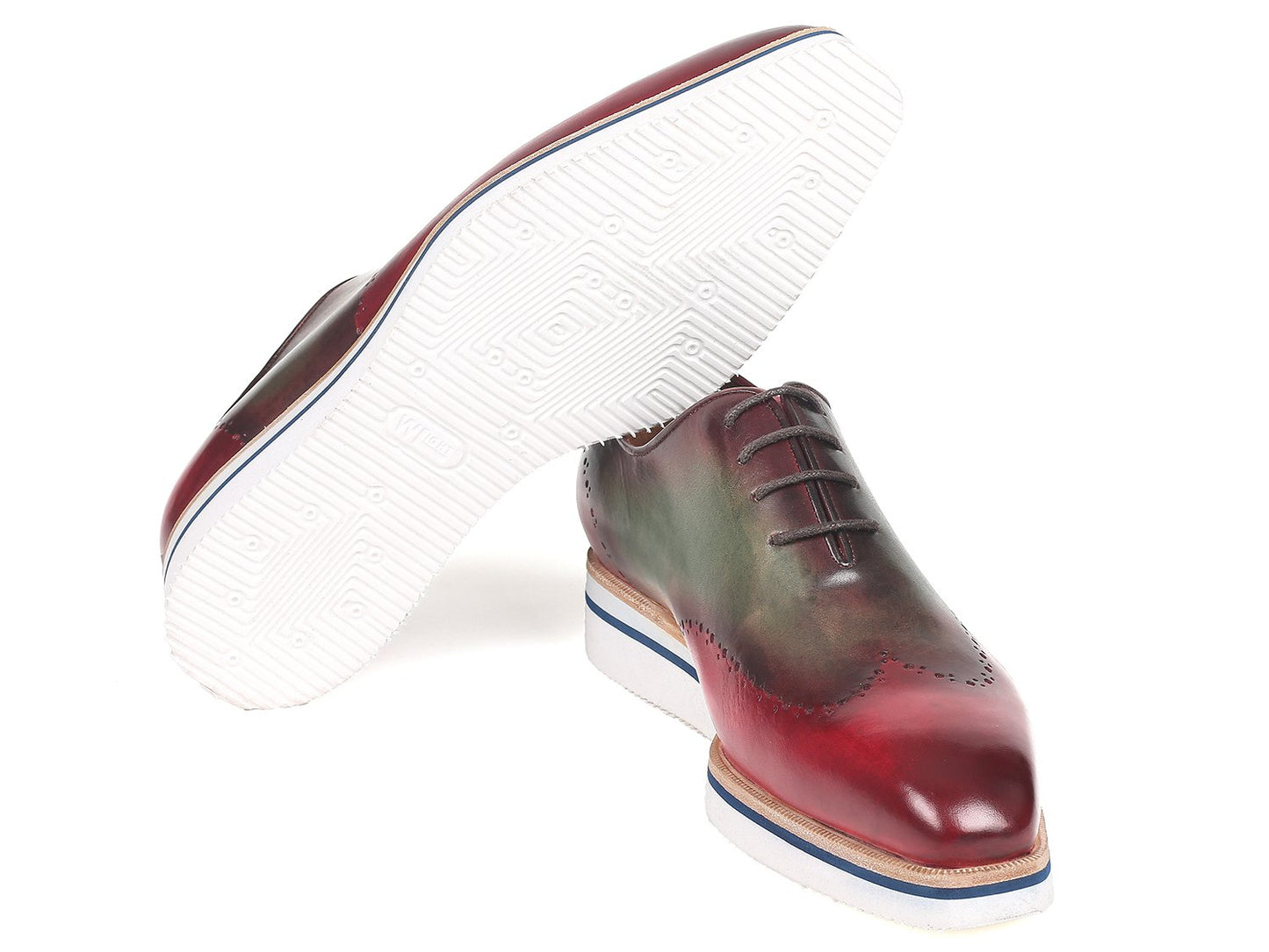 Introducing the Paul Parkman Smart Casual Wingtip Oxfords in Bordeaux & Green (187-BRD-GRN). These polished, multi-tone brogue shoes feature a handpainted upper with classic wingtip perforation and distinctive white and blue striped soles. The unique red and green gradient design makes them perfect for those seeking smart casual footwear that truly stands out.