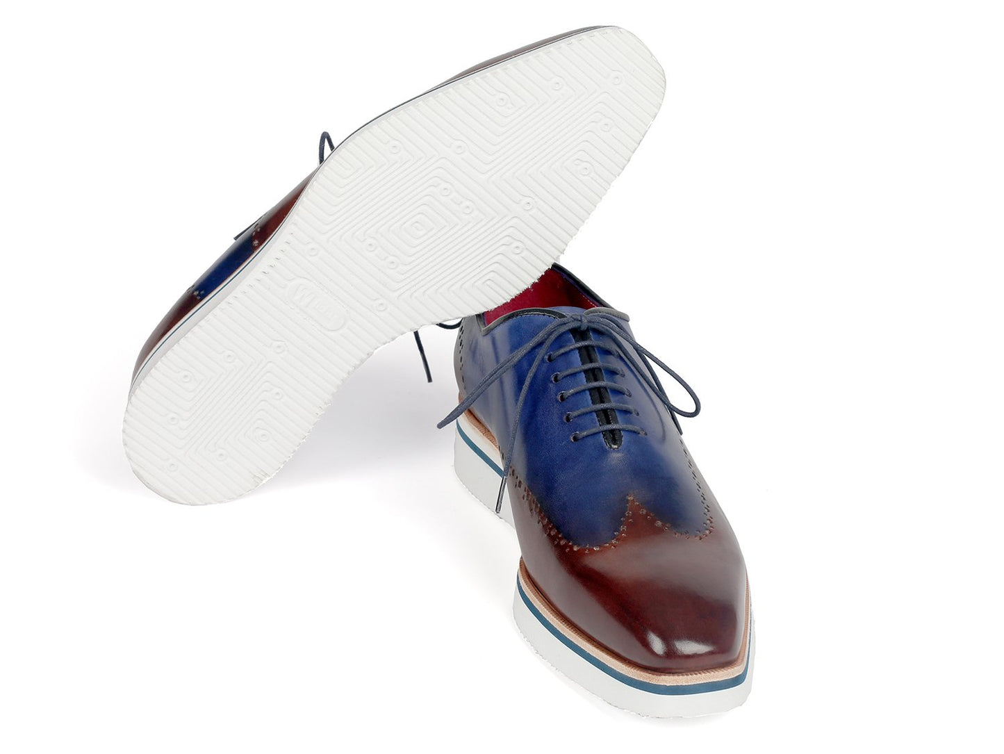 Paul Parkman introduces the Smart Casual Wingtip Oxfords Brown & Blue - 187-BRW-BLU, which feature a stylish combination of blue and brown hand-painted leather, elegant wingtip perforations, white soles, and black laces for a sophisticated touch.