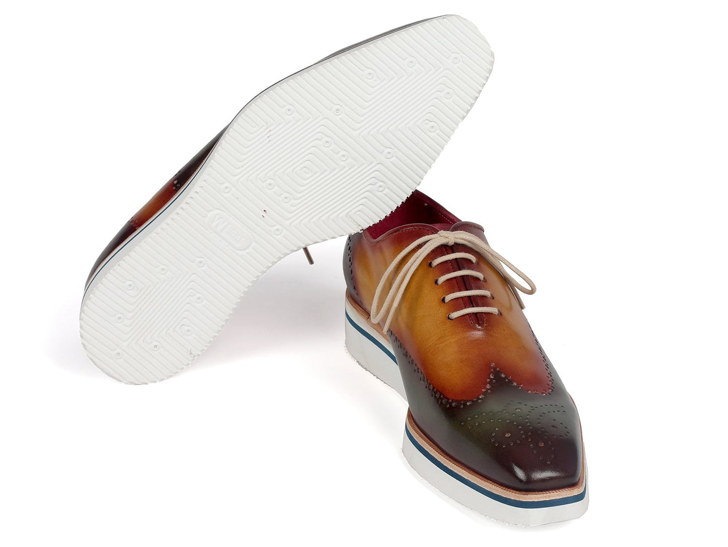 Featuring a multicolored finish of green and camel, the Paul Parkman Smart Casual Wingtip Oxfords (188-GRN-CML) boast hand-painted leather with elegant brogue detailing. Complete with white laces and soles, these sophisticated shoes are ideal for smart casual occasions, effortlessly combining style and refinement.