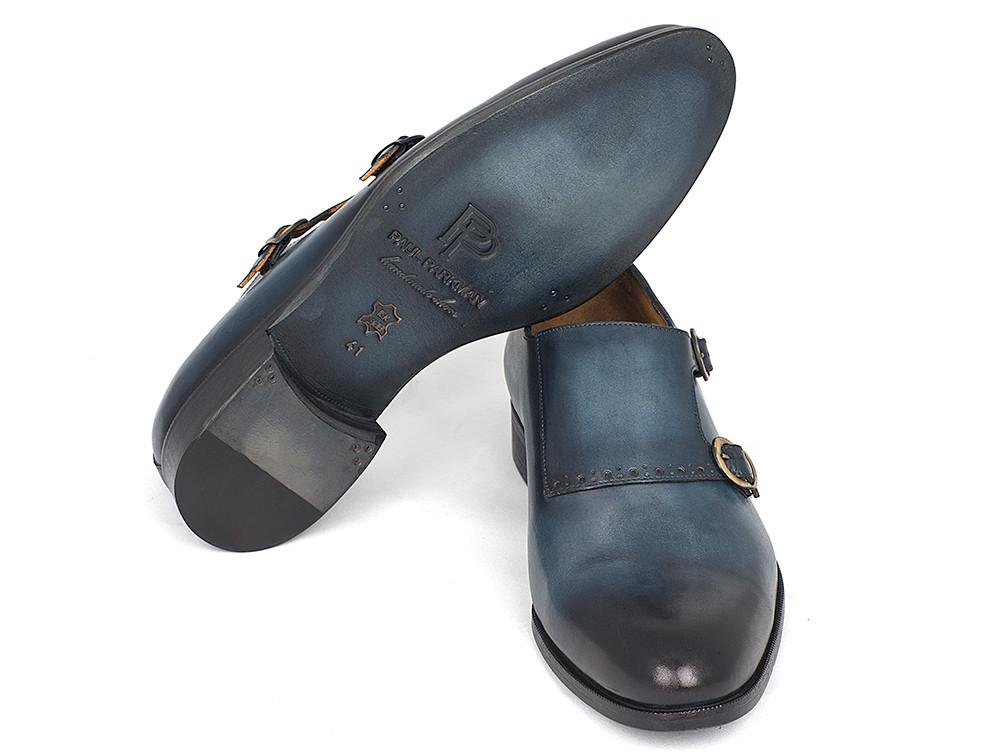 A pair of Paul Parkman Navy Double Monkstrap Shoes - HT54-NAVY, featuring hand-painted leather in navy with black tips and an antiqued leather sole, exhibited in a polished and professional style.