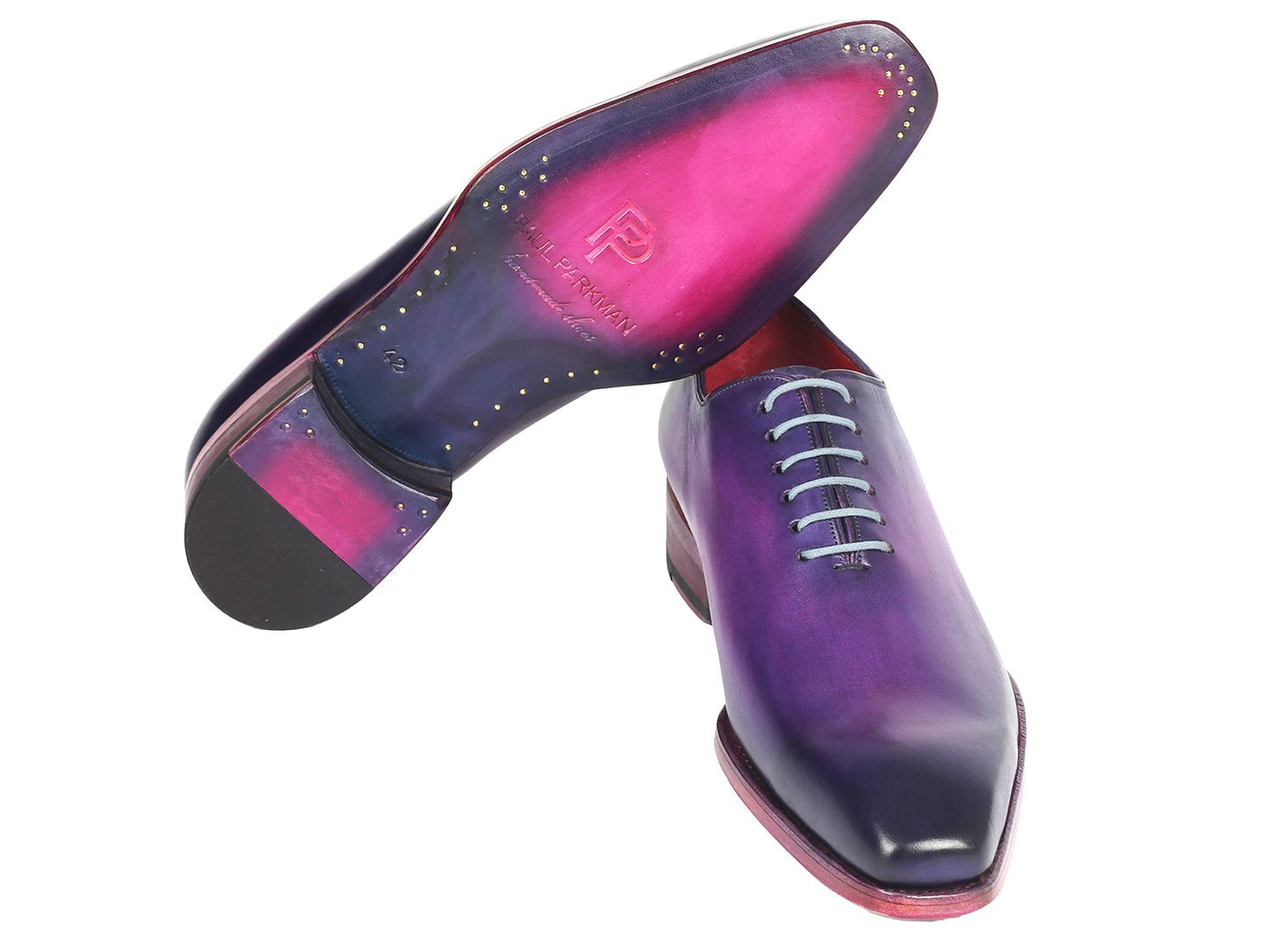The Paul Parkman Goodyear Welted Wholecut Oxfords in a purple hand-painted design feature light grey laces and a red interior, presented at an angle on a white background. These shoes exemplify meticulous detail and superior craftsmanship.