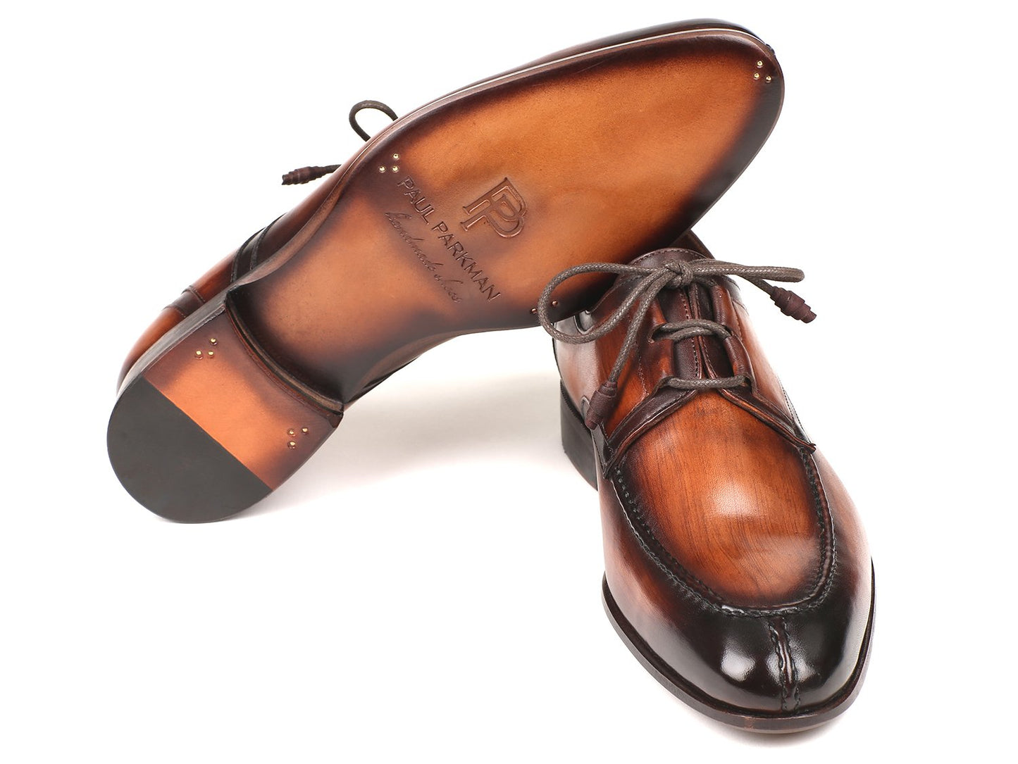 Introducing the Paul Parkman Ghillie Lacing Brown Burnished Dress Shoes - GU567BRW, a pair of exquisite dress shoes crafted by Paul Parkman. Featuring intricate ghillie lacing, a polished finish, and detailed stitching, these hand-painted leather shoes are beautifully displayed against a white background, showcasing exceptional craftsmanship.