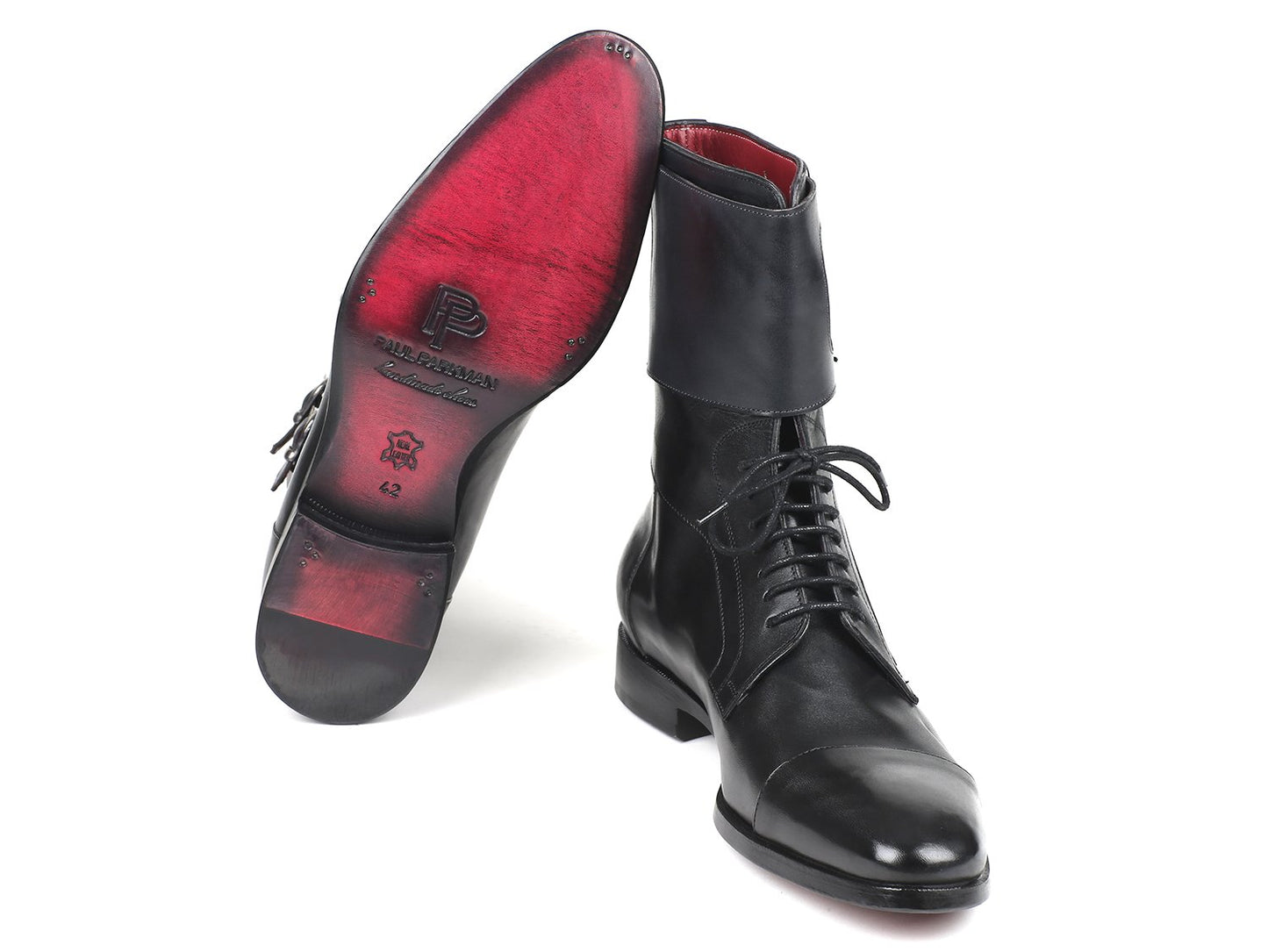 The Paul Parkman High Boots Black Calfskin - F555-BLK, produced by Paul Parkman, feature two hand-painted black leather lace-up boots standing side by side, with one boot leaning against the other to showcase a stylish red interior lining.