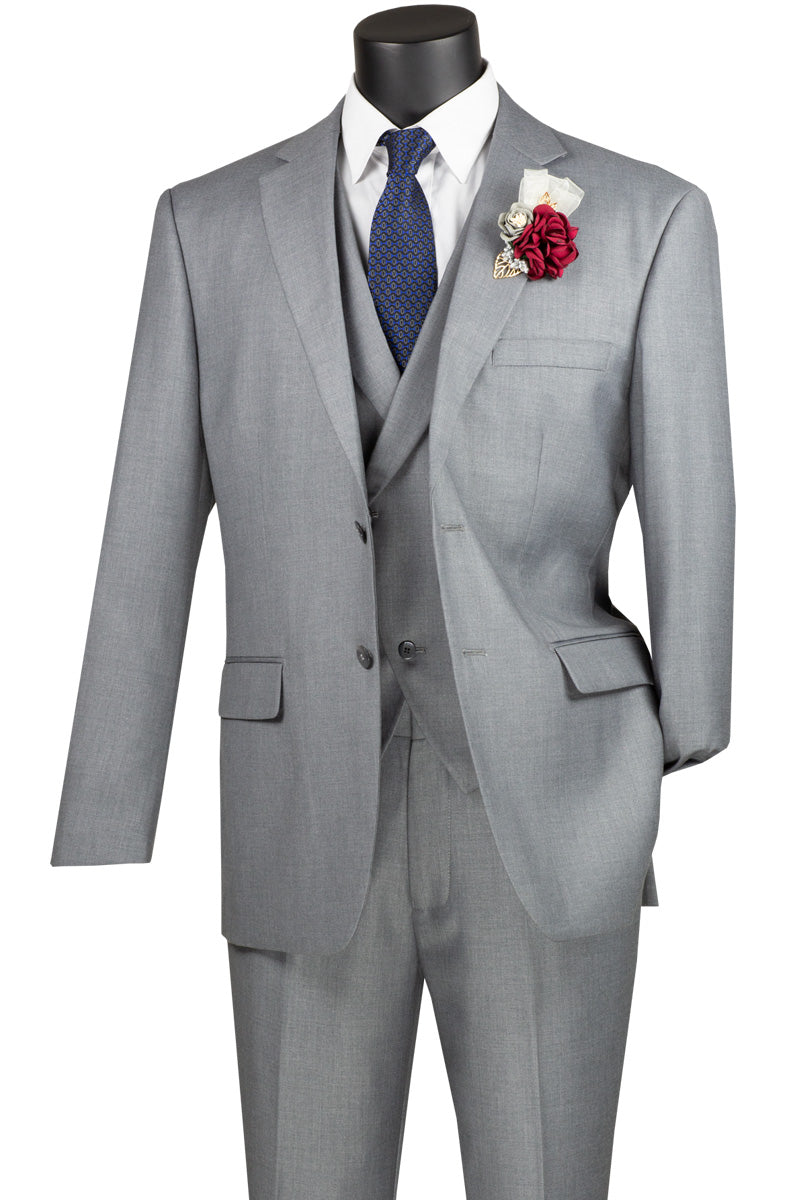 The Vinci Suits Modern Fit 3 Piece Single Breasted Suit in light gray, featuring a luxurious wool feel, comes with a white shirt and blue tie. A red and white boutonniere adorns the left lapel, all elegantly showcased on a mannequin.