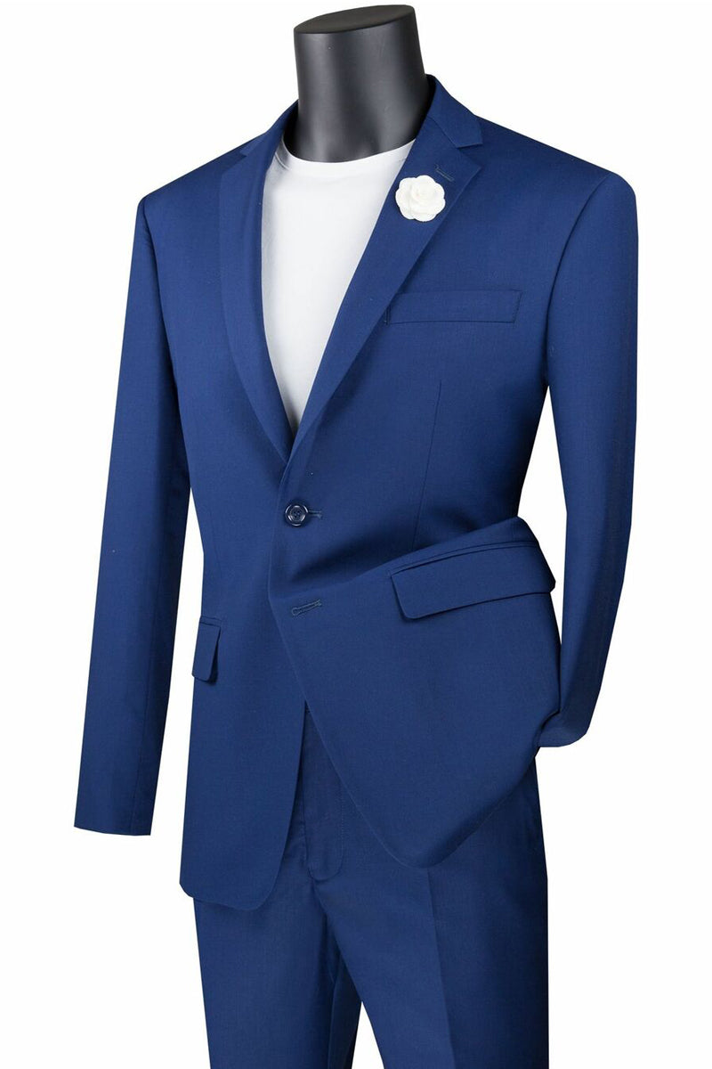 A mannequin elegantly displays the Vinci Suits Slim Fit 2 Piece 2 Button Suit (Twilight Blue) SC900-12 with a white shirt and flower on the lapel against a plain background.