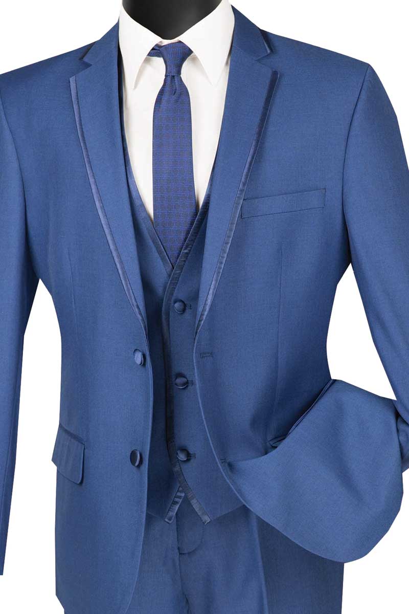 The Vinci Suits Slim Fit 2 Button 3 Piece Suit (Blue) SV2T-8 includes a tie and white shirt, featuring a buttoned jacket with naturally draping sleeves. Its wrinkle-resistant fabric keeps the faceless mannequin display looking polished.