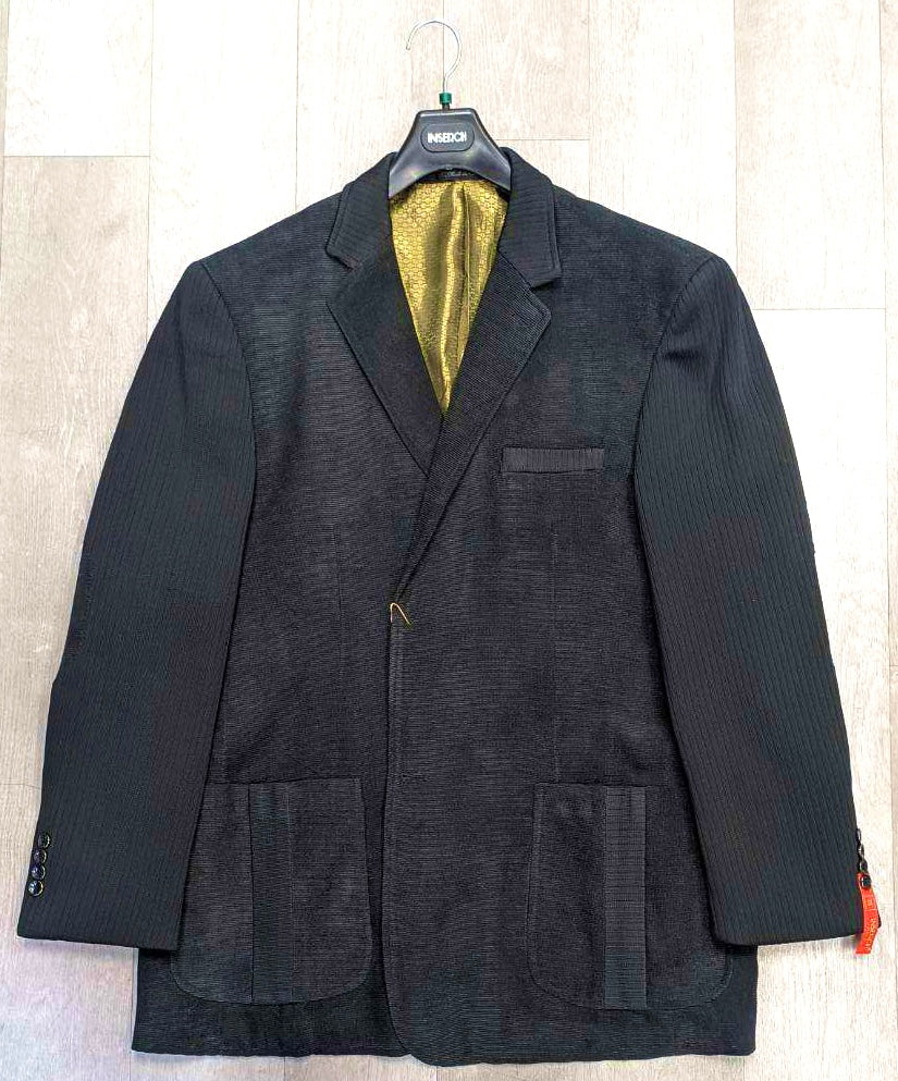 A sophisticated black Inserch Blazer BL506-01, available exclusively in size 3XL, with a notched lapel and vibrant yellow lining, hangs elegantly on a hanger. It features two front pockets and a chest pocket.