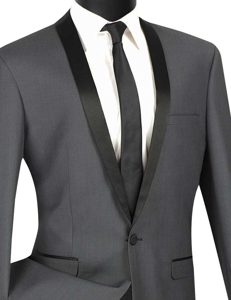 The Slim Fit 2 Piece 1 Button Shawl Collar Tuxedo (Heather Gray) T-SS by Vinci Suits is elegantly displayed on a mannequin, featuring a sleek gray suit with a black lapel. Paired with a white dress shirt and black tie, its wrinkle-resistant fabric ensures you look sharp at any event.