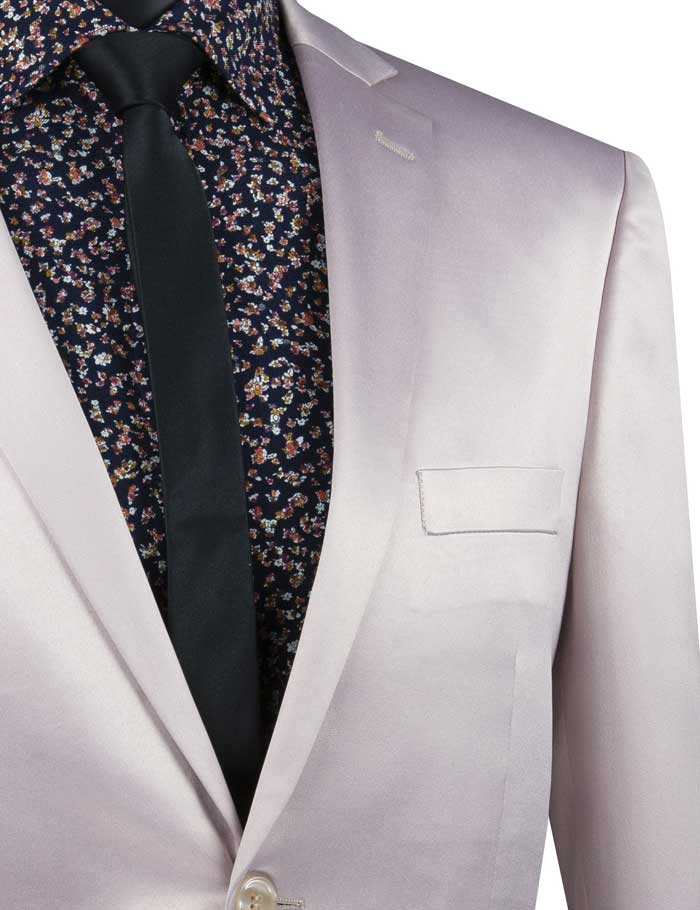 A mannequin features the Vinci Suits' Ultra Slim Fit Stretch Sateen Suit in blush, combined with an elegant black floral shirt and solid dark tie, for a contemporary look.