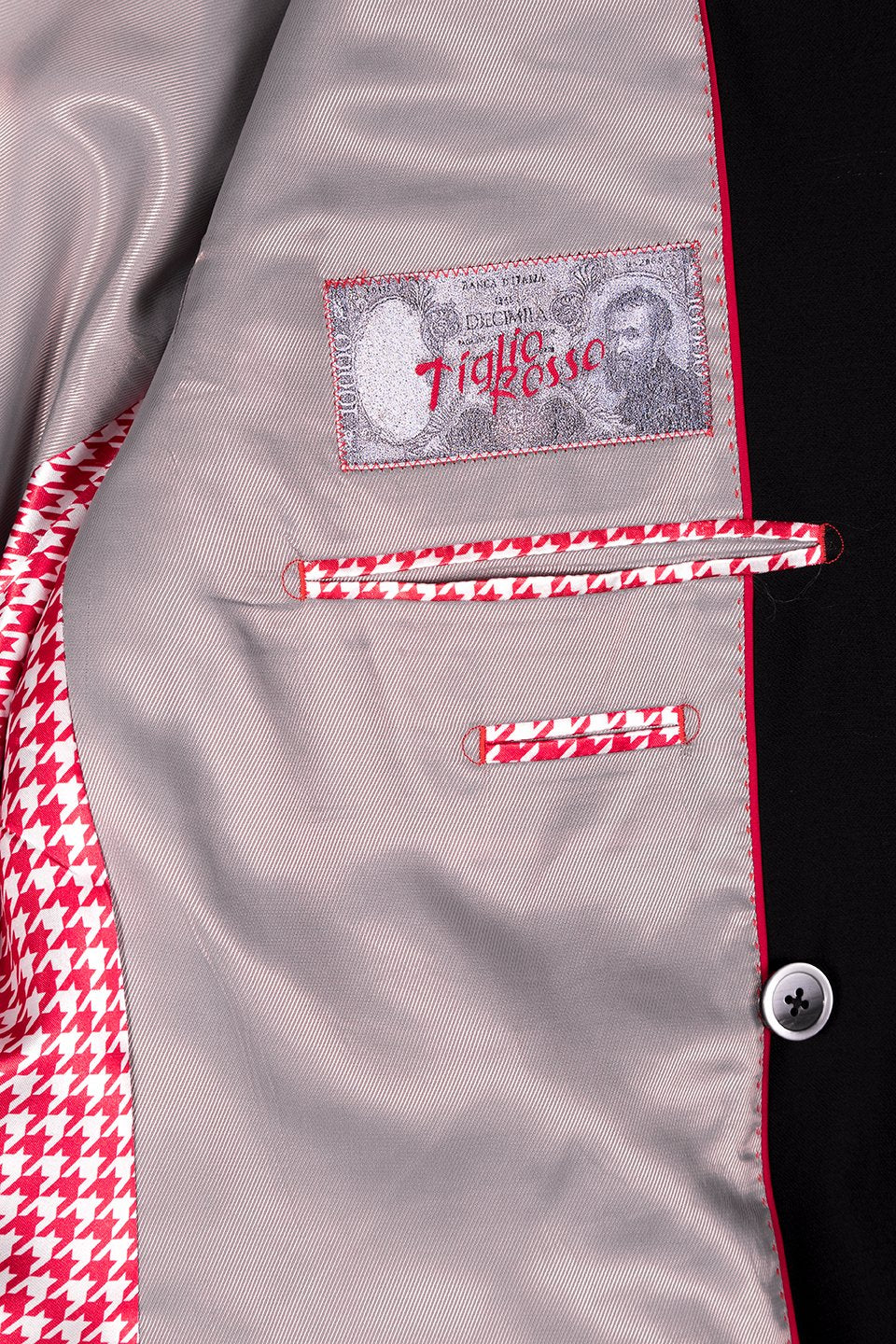 A sophisticated flair is offered by a Tiglio Rosso DB ESTE Solid Black TIG1001 suit, with a polka dot bow tie and pocket square, displayed on a mannequin.