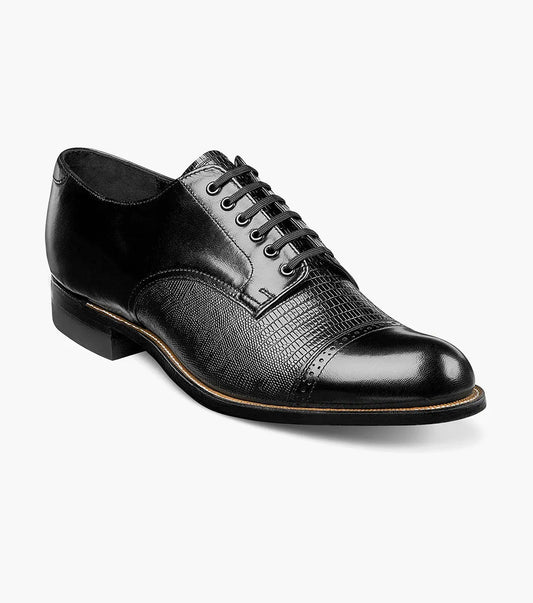 The Stacy Adams Madison Lizard Cap Toe Oxford (00049-01) is a black kidskin leather dress shoe for men, featuring a lizard print cap toe and five eyelets, shown against a white background. Brand: STACY ADAMS.