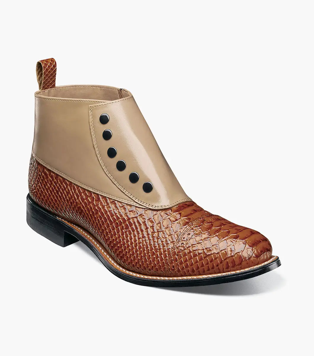 The Stacy Adams Madison Spectator Spat Cap Toe Demi Boot in Tan Multi (00109-238) features a brown and tan ankle boot design with black buttons, a textured reptile-like lower portion, and smooth kidskin leather on the upper section, crafted in STACY ADAMS’ distinctive spectator boot style.