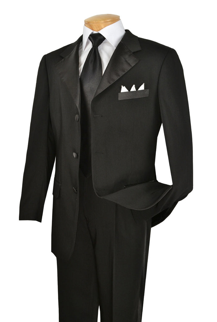Admire the Vinci Suits' Regular Fit 2 Piece 3 Button Tuxedo Black T-3HT, a sleek outfit with a wrinkle-resistant micro-fiber finish, paired with a crisp white shirt, black tie, and pocket square. Elegantly displayed on a mannequin against a plain background.