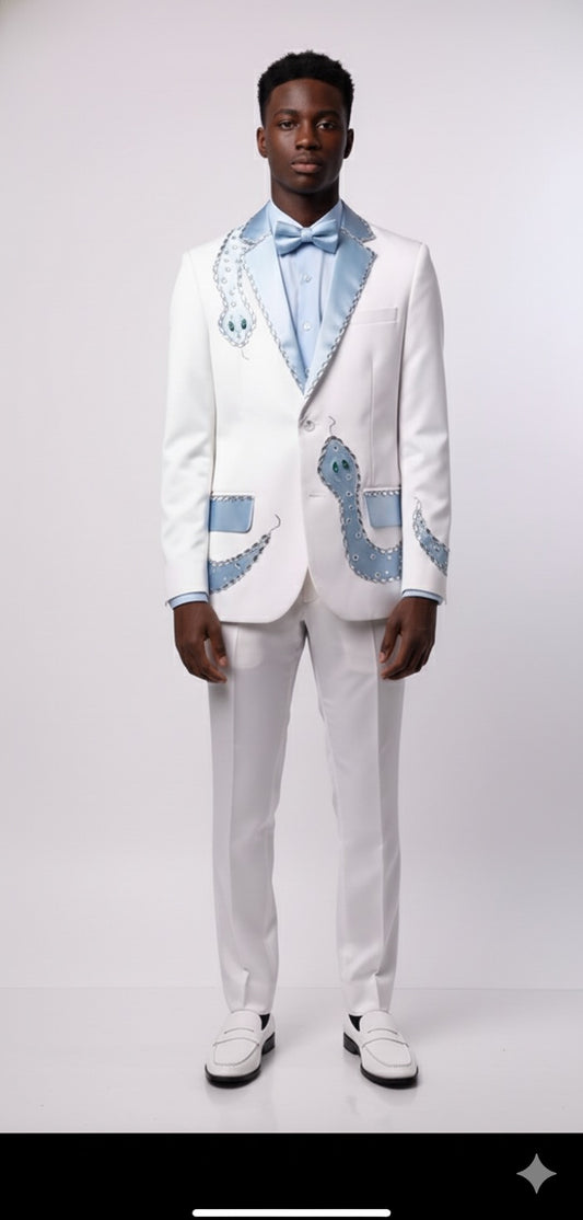 A man faces forward in a Unique Design Menswear Custom Prom Suit: white with sky blue snake pattern, light blue shirt, bow tie, and white shoes, set against a plain background.