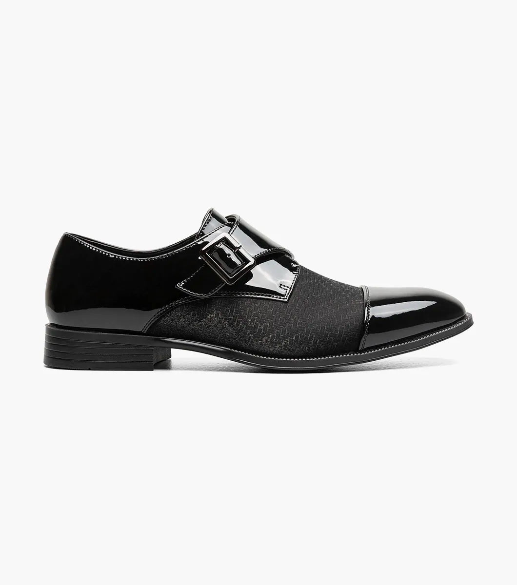 The STACY ADAMS Sutherland Cap Toe Monk Strap in black (style 25793-001) is a formal leather dress shoe with a glossy cap toe, single side buckle, and low heel, shown against a plain white background. These monk strap shoes are designed for all-day comfort with a memory foam insole.