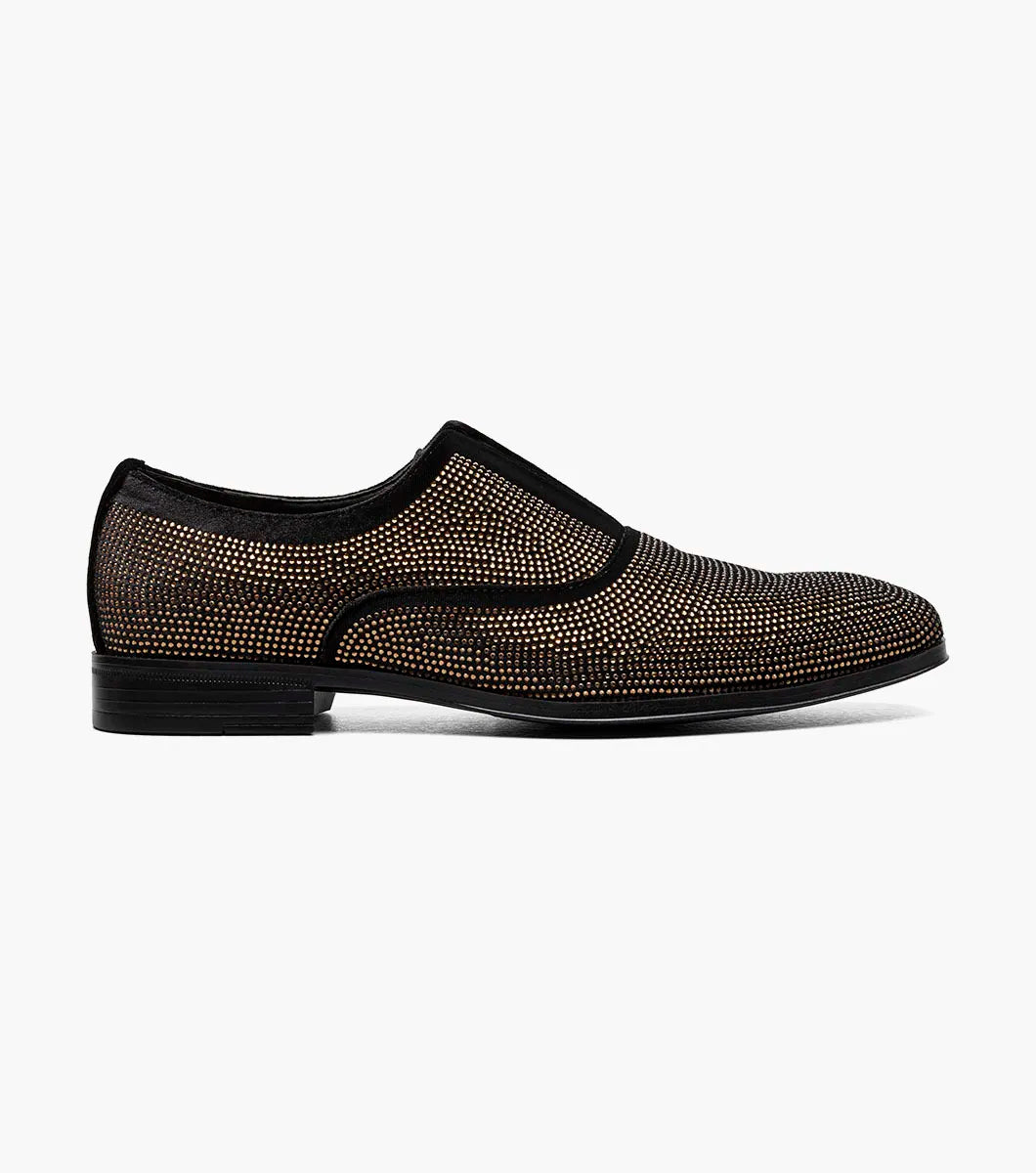 The STACY ADAMS Starleigh Rhinestone Plain Toe Slip On (25685-715) is a men's black and gold dress shoe with a low heel, featuring small gold studs on the velour textile upper.