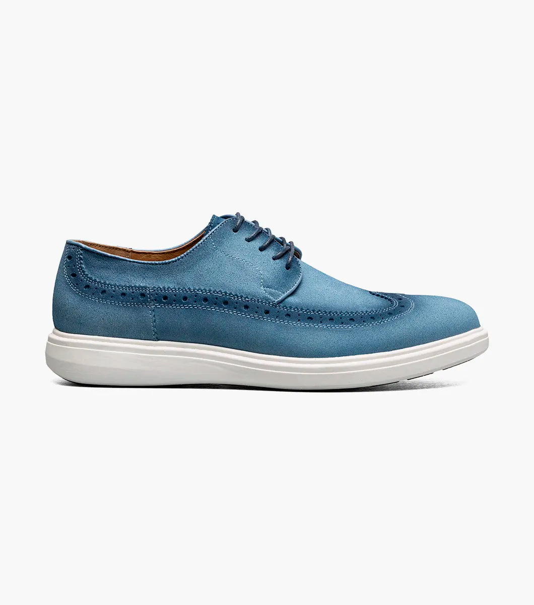 A single STACY ADAMS Trudell Wingtip Lace Up (Light Blue, 25691-459) suede oxford shoe with decorative stitching and a white rubber sole is displayed on a plain light background.