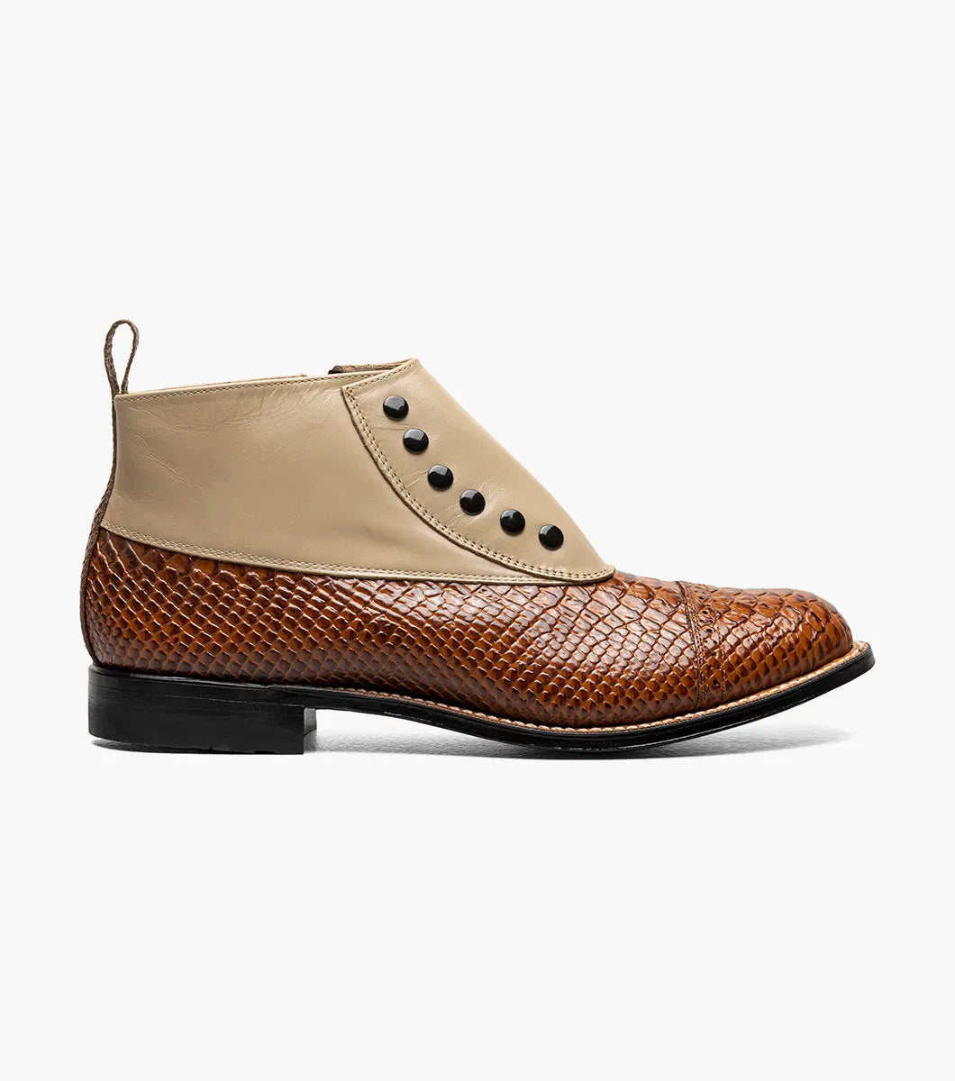 The Stacy Adams Madison Spectator Spat Cap Toe Demi Boot in Tan Multi (00109-238) features a brown and tan ankle boot design with black buttons, a textured reptile-like lower portion, and smooth kidskin leather on the upper section, crafted in STACY ADAMS’ distinctive spectator boot style.