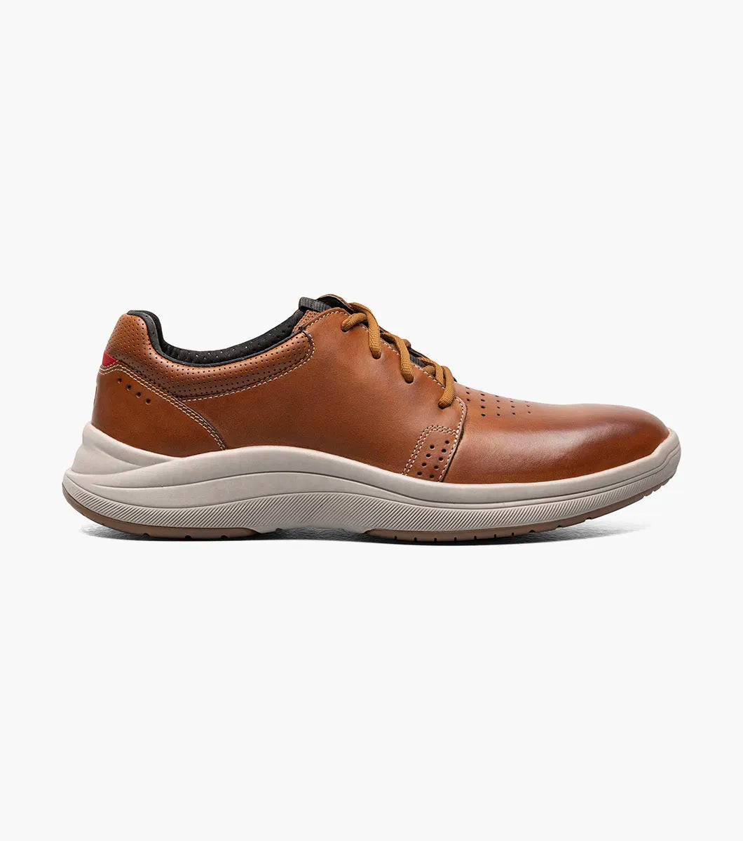 The STACY ADAMS Lennox Plain Toe Lace Up in Cognac Smooth has a beige rubber sole, black lining, perforated toe detail, and a cushioned RedZone footbed for comfort. Style number: 25573-225.