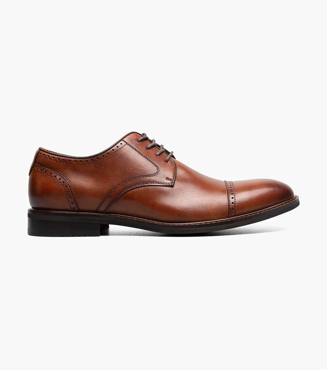 The STACY ADAMS Bailey Cap Toe Oxford in Brandy (25750-226) features brown leather, subtle stitching, and classic laced design—ideal men’s formal shoes displayed on a white background.