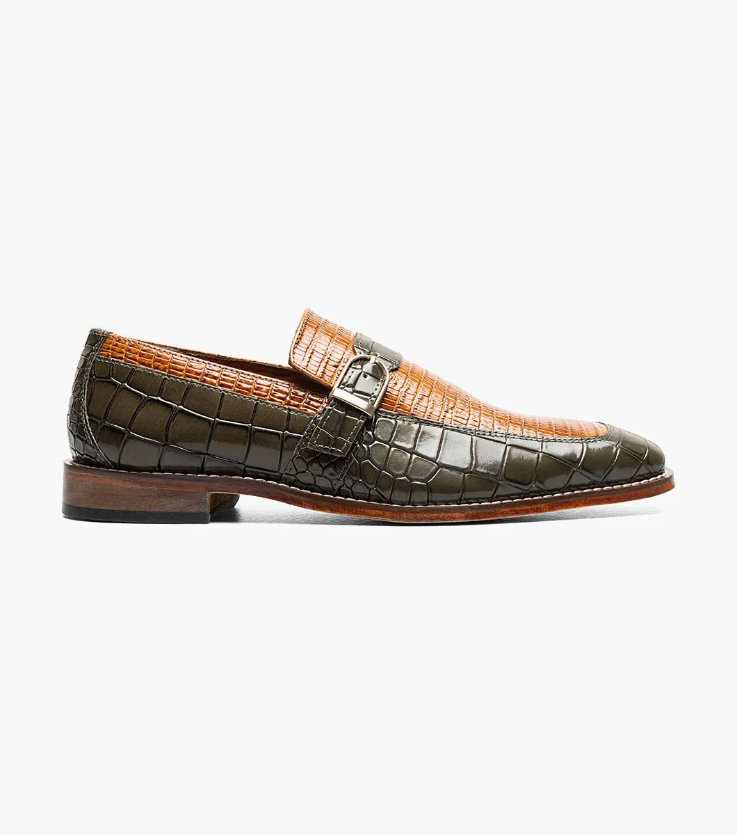 Here’s a rewritten version of the sentence using your product data: The Stacy Adams Rubiano Moc Toe Buckle Strap Slip On in Olive Multi features a brown textured upper, dark green crocodile print leather sides, a small silver buckle, and a reddish-brown sole. This STACY ADAMS men’s loafer is designed with a cushioned footbed for added comfort.