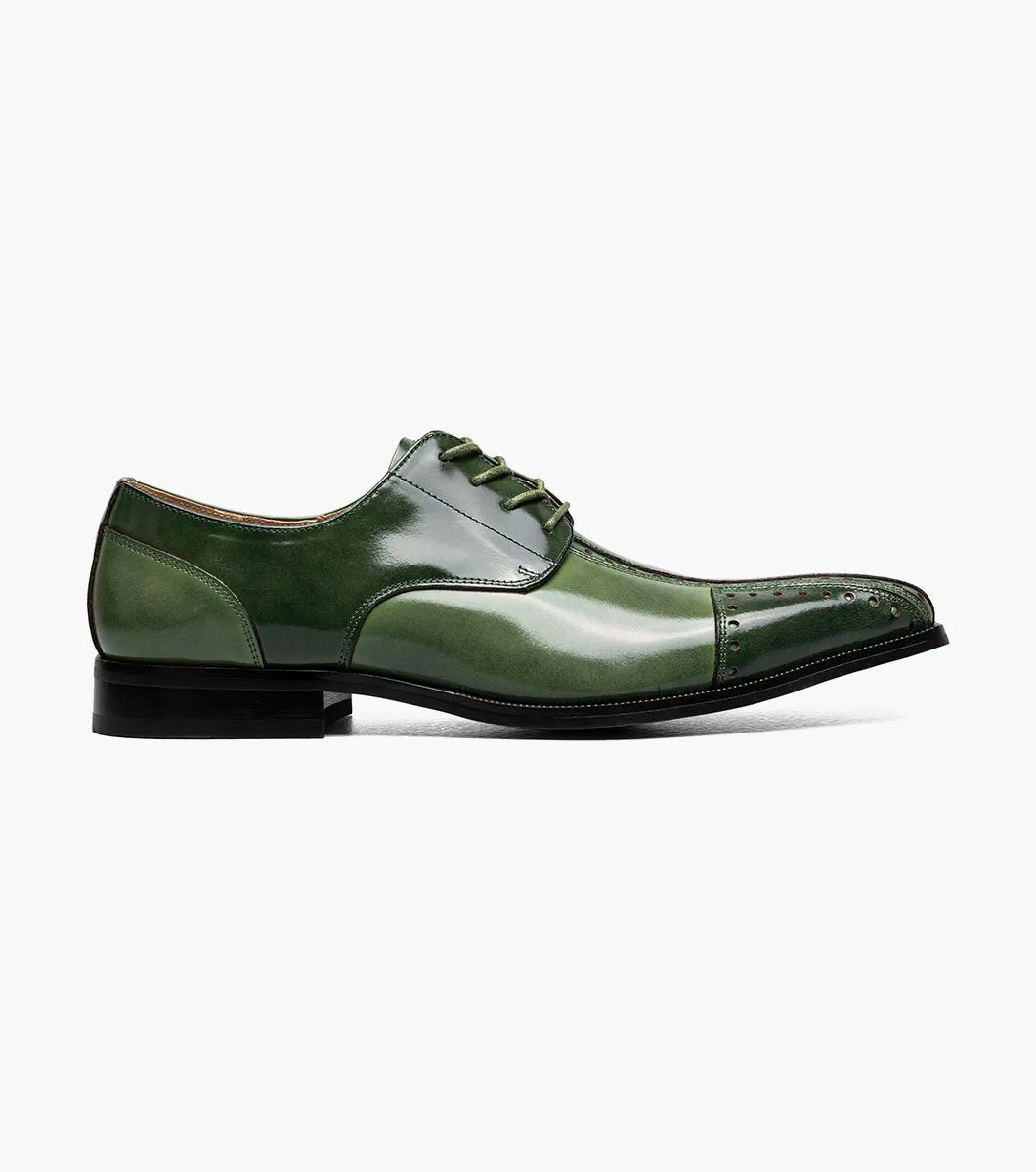 The Stacy Adams Palmento Modified Cap Toe Oxford in Green Multi (25740-340) features a leather upper, closed lacing, low black heel, decorative stitching and perforations, and is shown as a single shoe on a white background.