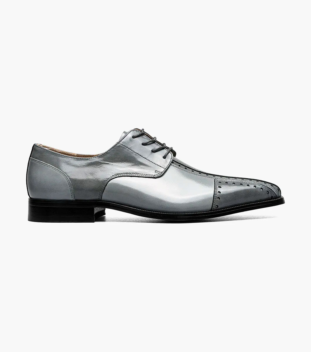 The STACY ADAMS Palmento Modified Cap Toe Oxford (Gray Multi, 25740-062) features decorative perforations, laces, a leather upper, and low heel, shown as a single dress shoe on a white background.