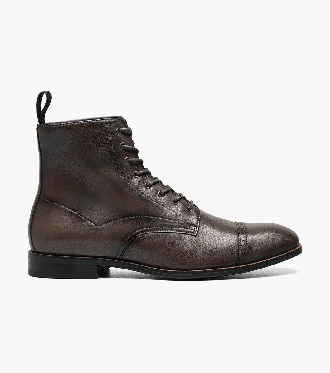 The STACY ADAMS Henry Cap Toe Lace Up Boot in gray (25718-020) features a leather upper, cap toe, side stitching, low black heel, and durable rubber outsole. Shown in side profile against a white background.