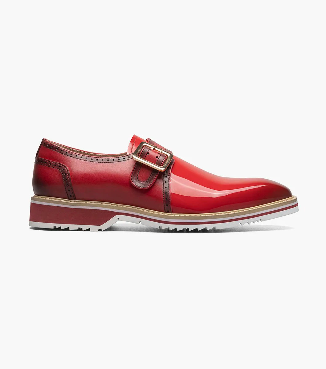 The Stacy Adams Bartram Plain Toe Monk Strap in red features a glossy patent upper, monk strap buckle, brown accents, and a white treaded sole for standout style.