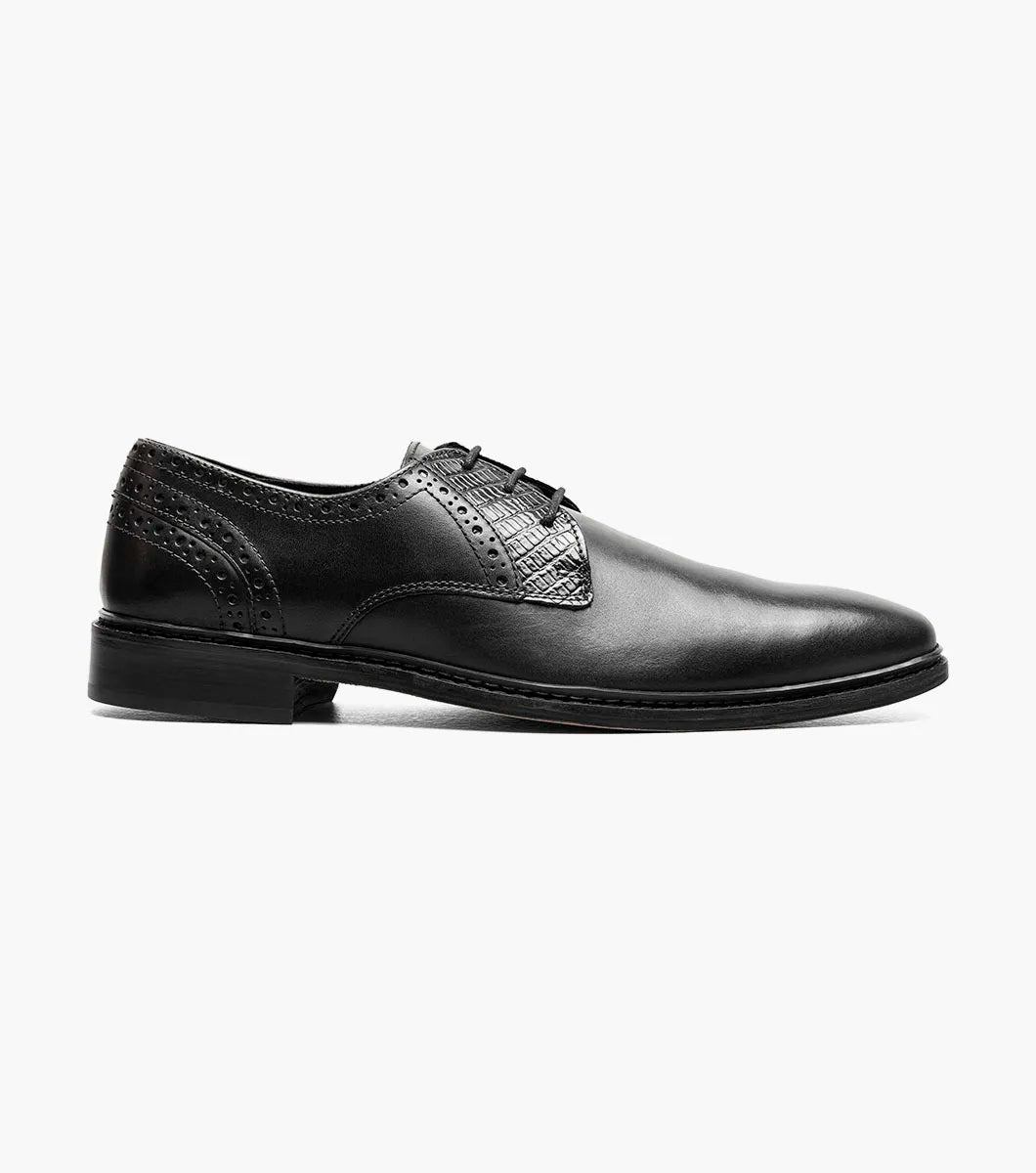 The Stacy Adams Giorgetti Plain Toe Oxford in black features lizard print leather, a low heel, lace-up closure, textured accents by the laces, and a cushioned footbed, shown on a plain white background.