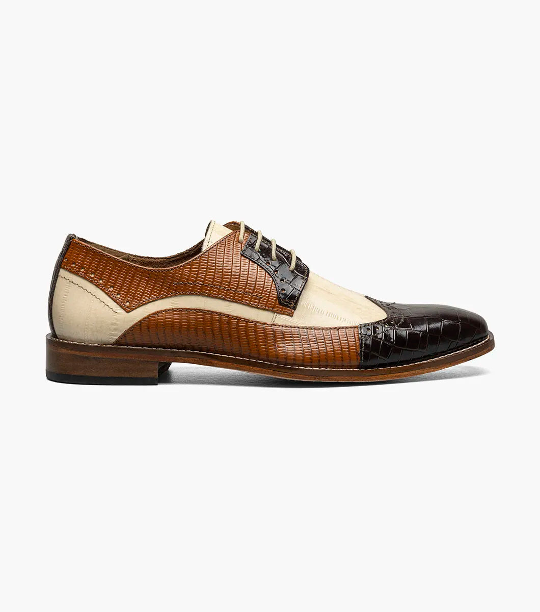 The STACY ADAMS Gallinari Wingtip Lace Up (Brown Multi, 25660-249) is a men's two-tone dress shoe with brown crocodile-textured leather, beige panels, cushioned footbed, lace-up design, and low heel.